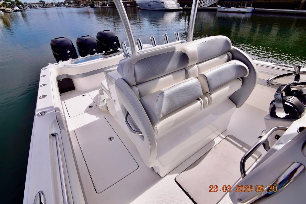2014 Nor-Tech 392 Super Fish boat interior with seating and triple outboard motors.