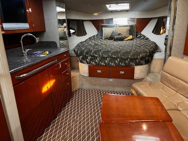 Interior of 2006 Formula 34 Performance Cruiser with bed, kitchenette, and seating area.