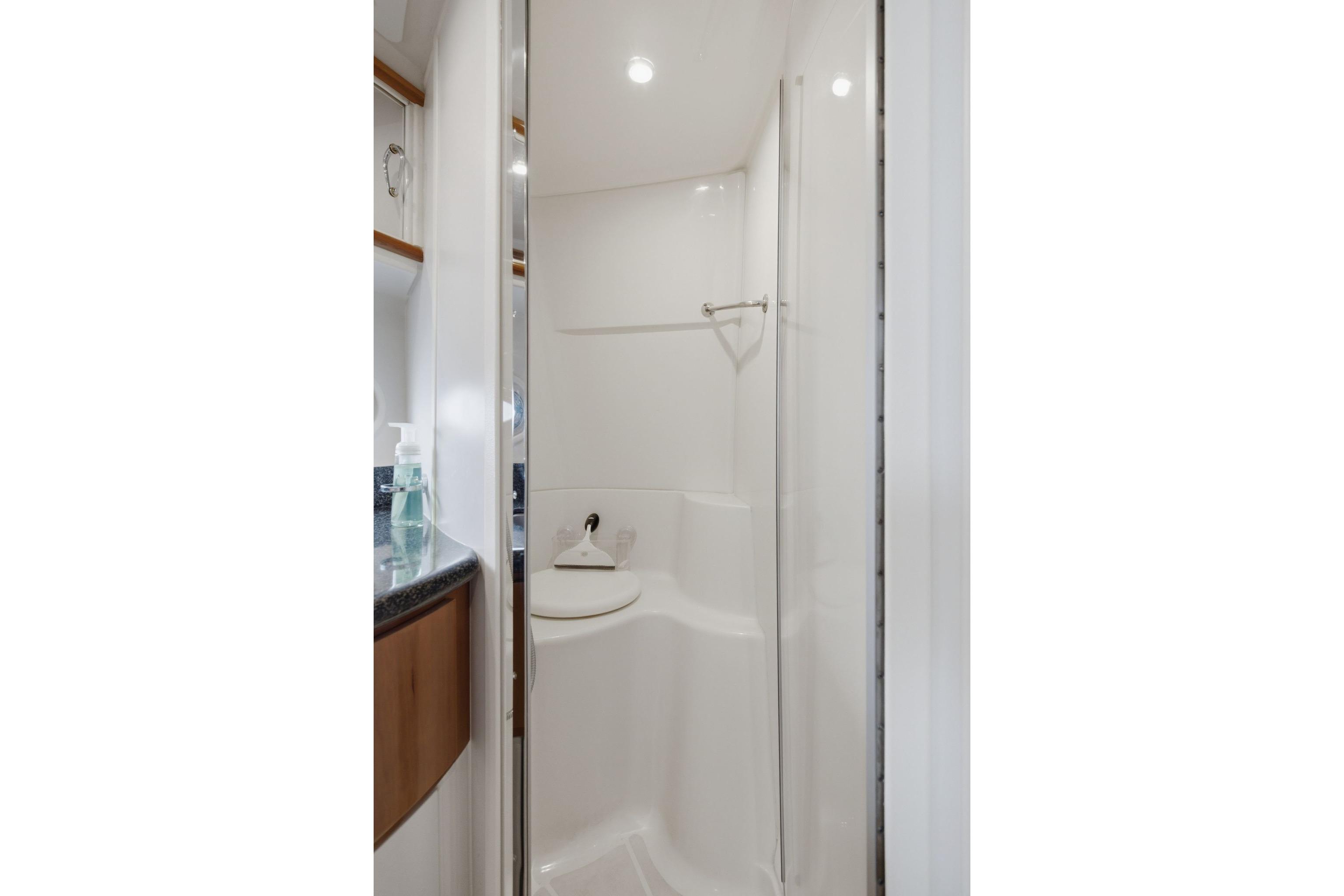 Bathroom interior of 2005 Carver 39 Motor Yacht with modern shower design.
