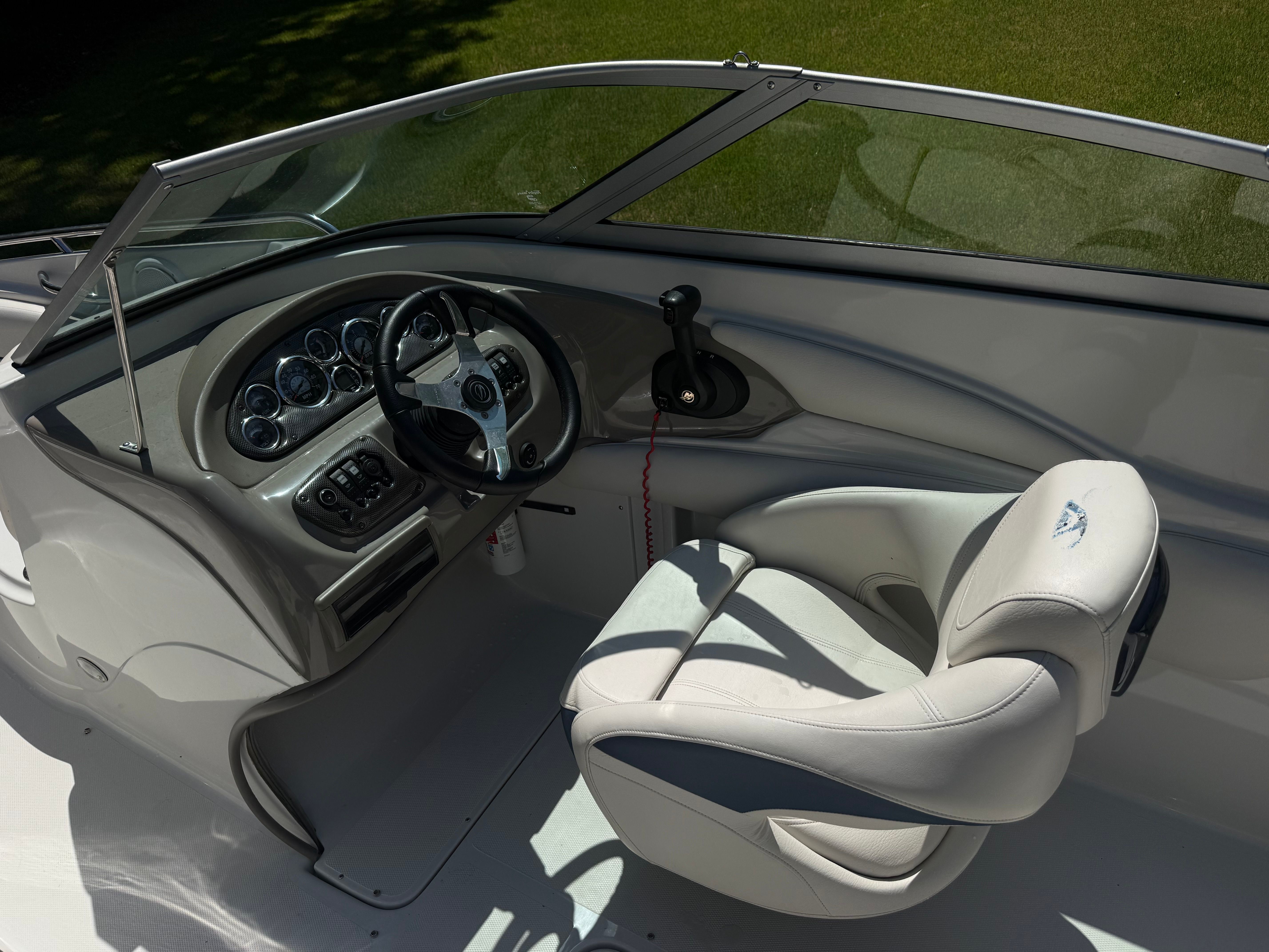 Interior of a 2008 Crownline 210 LX boat with steering console.