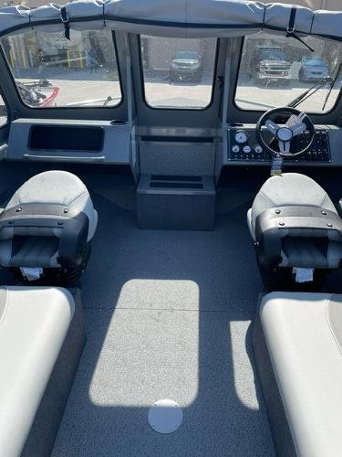 Interior of 2025 Spartan 185 Astoria boat with modern seating and dashboard.