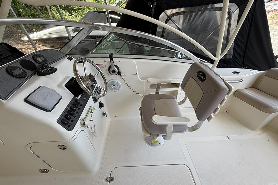 Helm of 2007 Scout 222 Dorado boat with steering wheel and seating.
