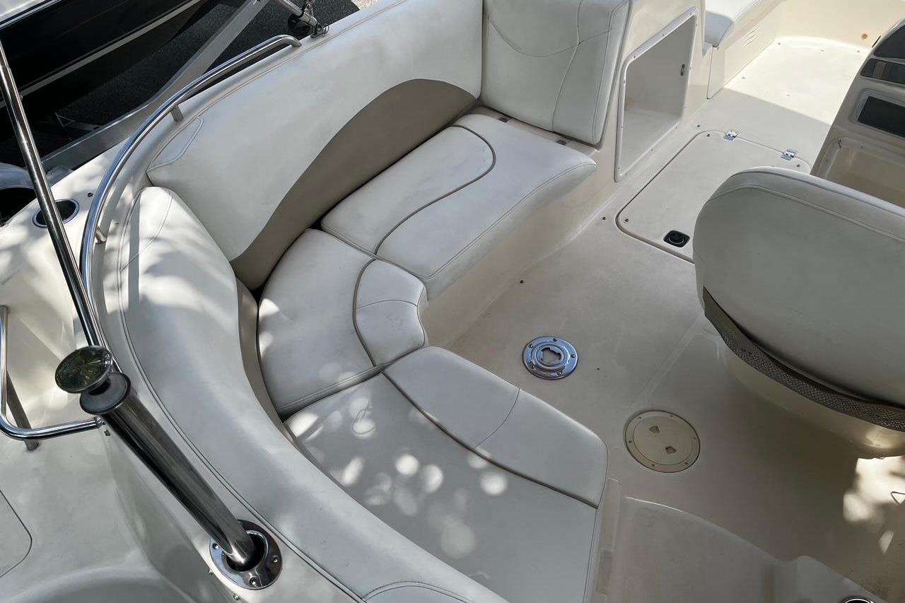 Interior of a 2008 Hurricane FD202 boat with white seating and sleek design.