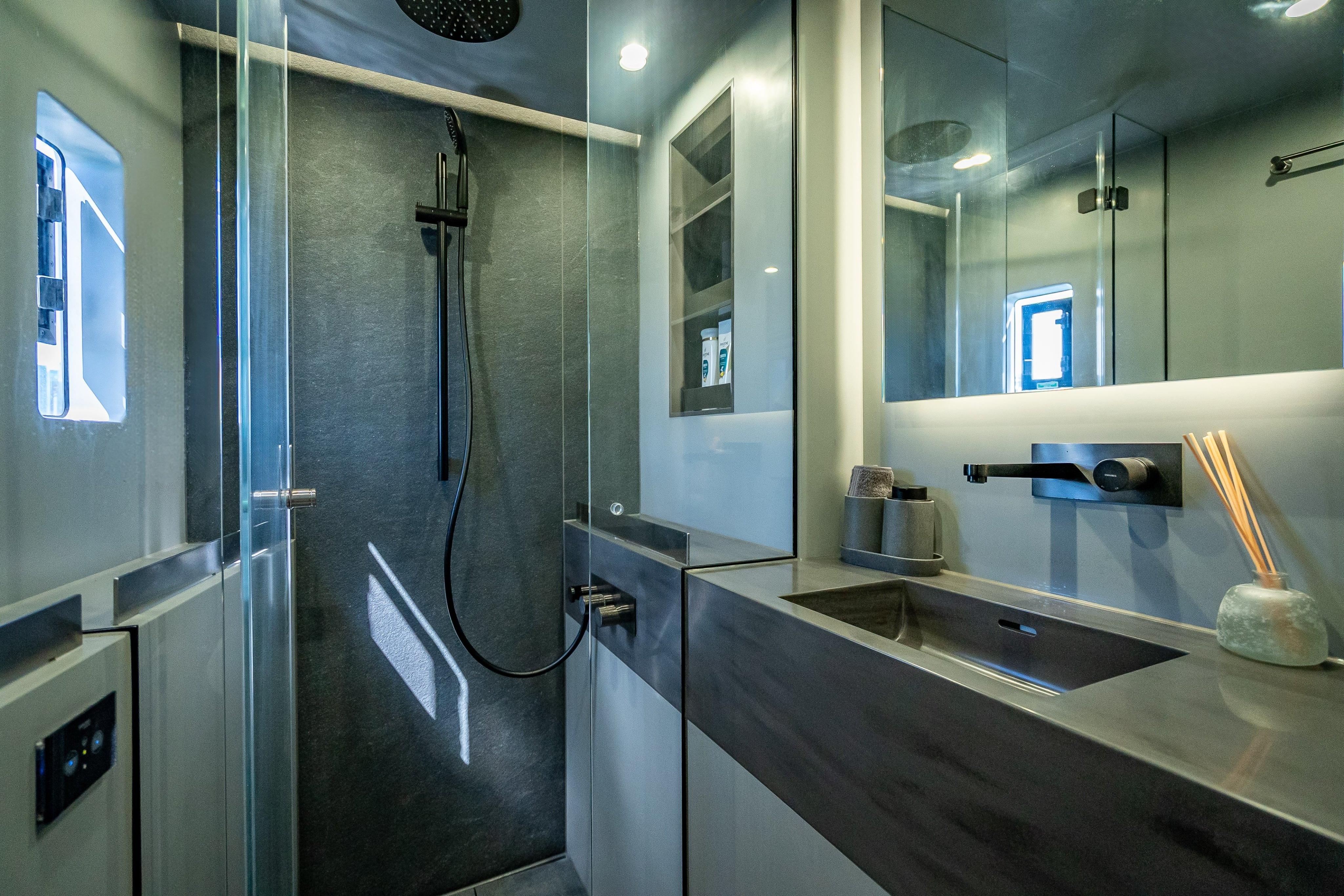 Luxurious bathroom in 2026 Sunreef 60 Power yacht with modern fixtures and sleek design.