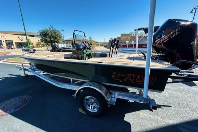 2026 Mako 18 Pro Skiff Backwater Edition on trailer, parked outdoors.