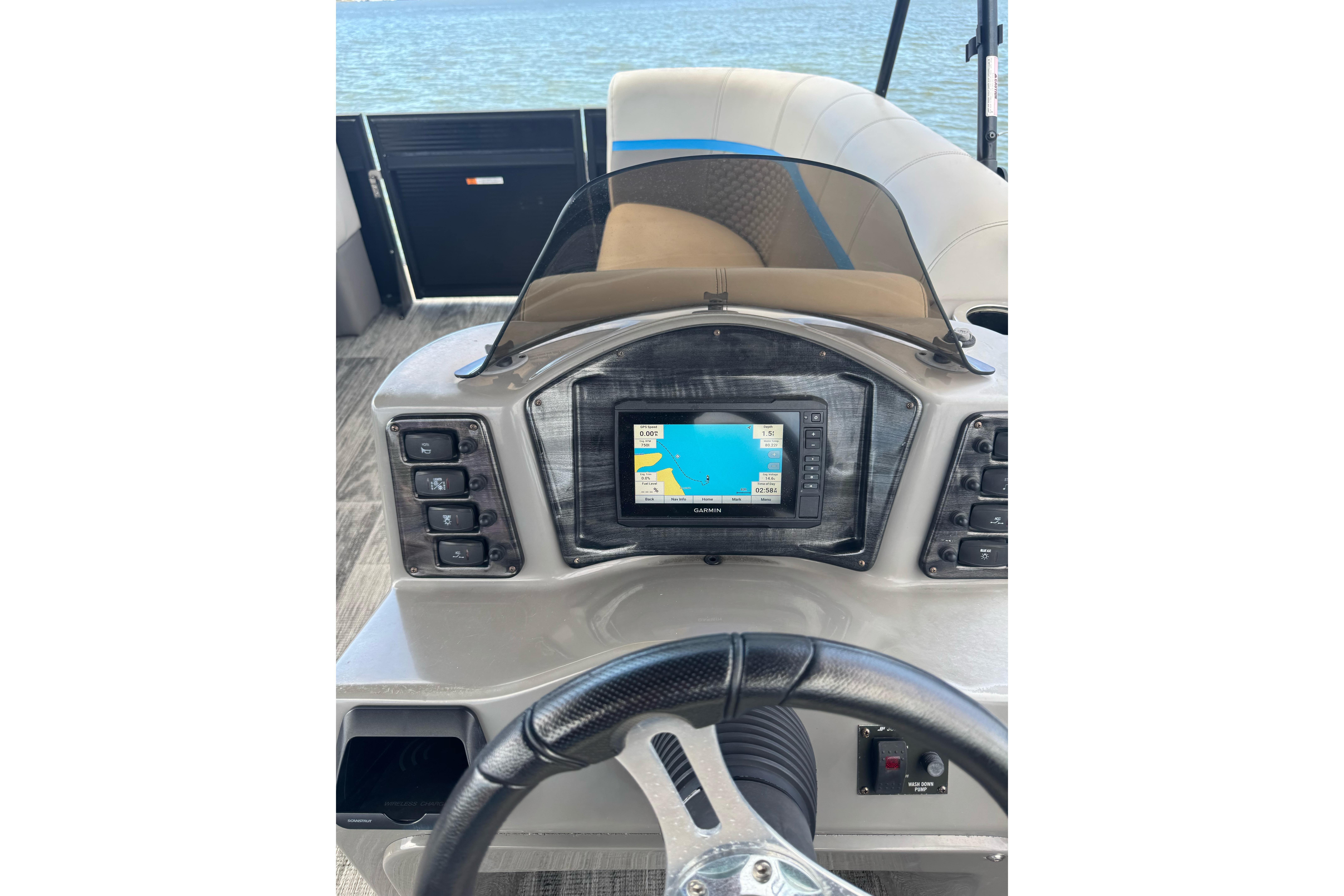 Cockpit of 2022 Qwest Edge 820 CTR boat with Garmin navigation system.