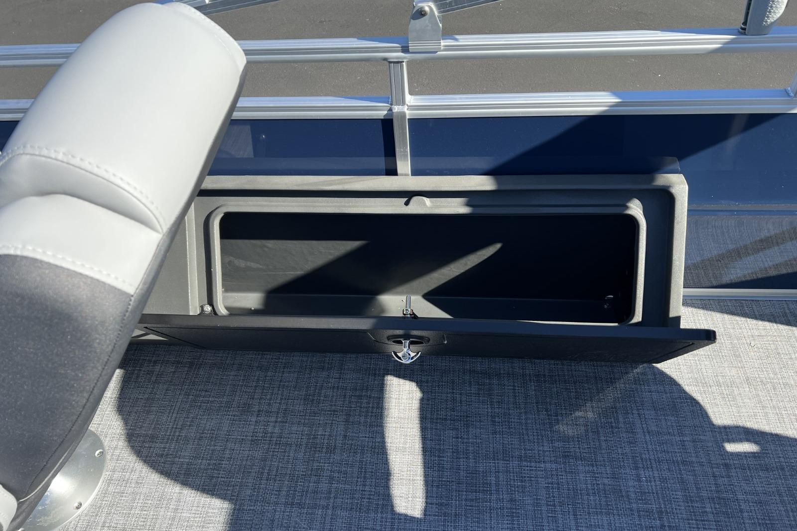 2026 Sun Tracker SportFish 22 DLX storage compartment with open hatch on deck.