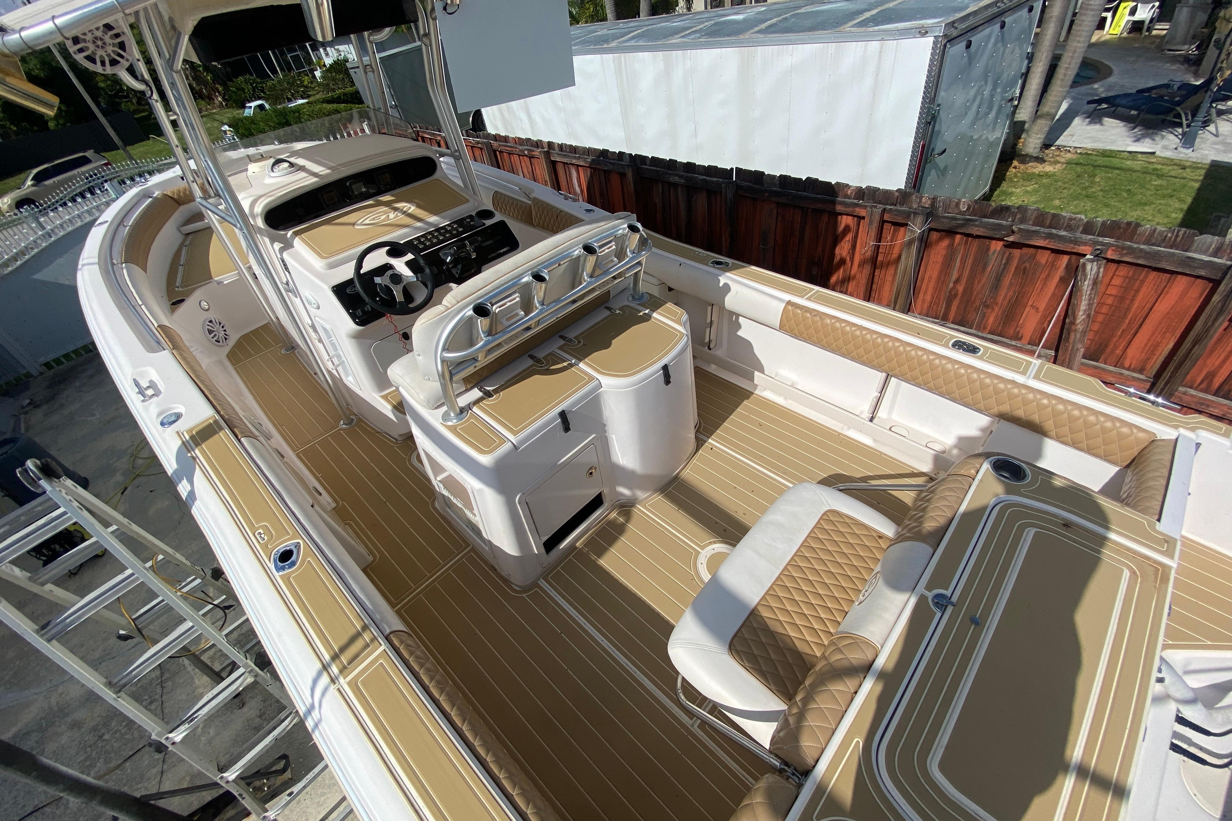 2004 Grady-White Canyon 283 boat interior with tan and white seating and helm.