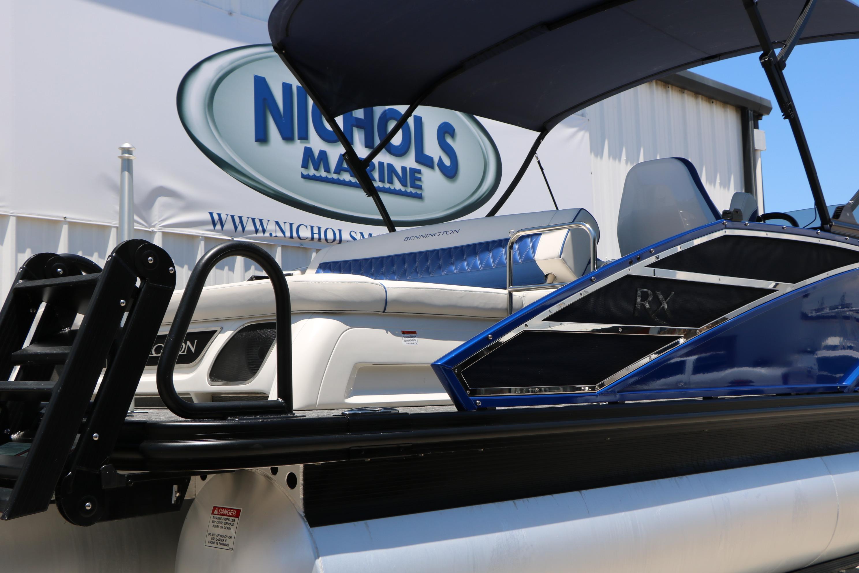 2024 Bennington 23 RX Swingback pontoon boat at Nichols Marine dealership.