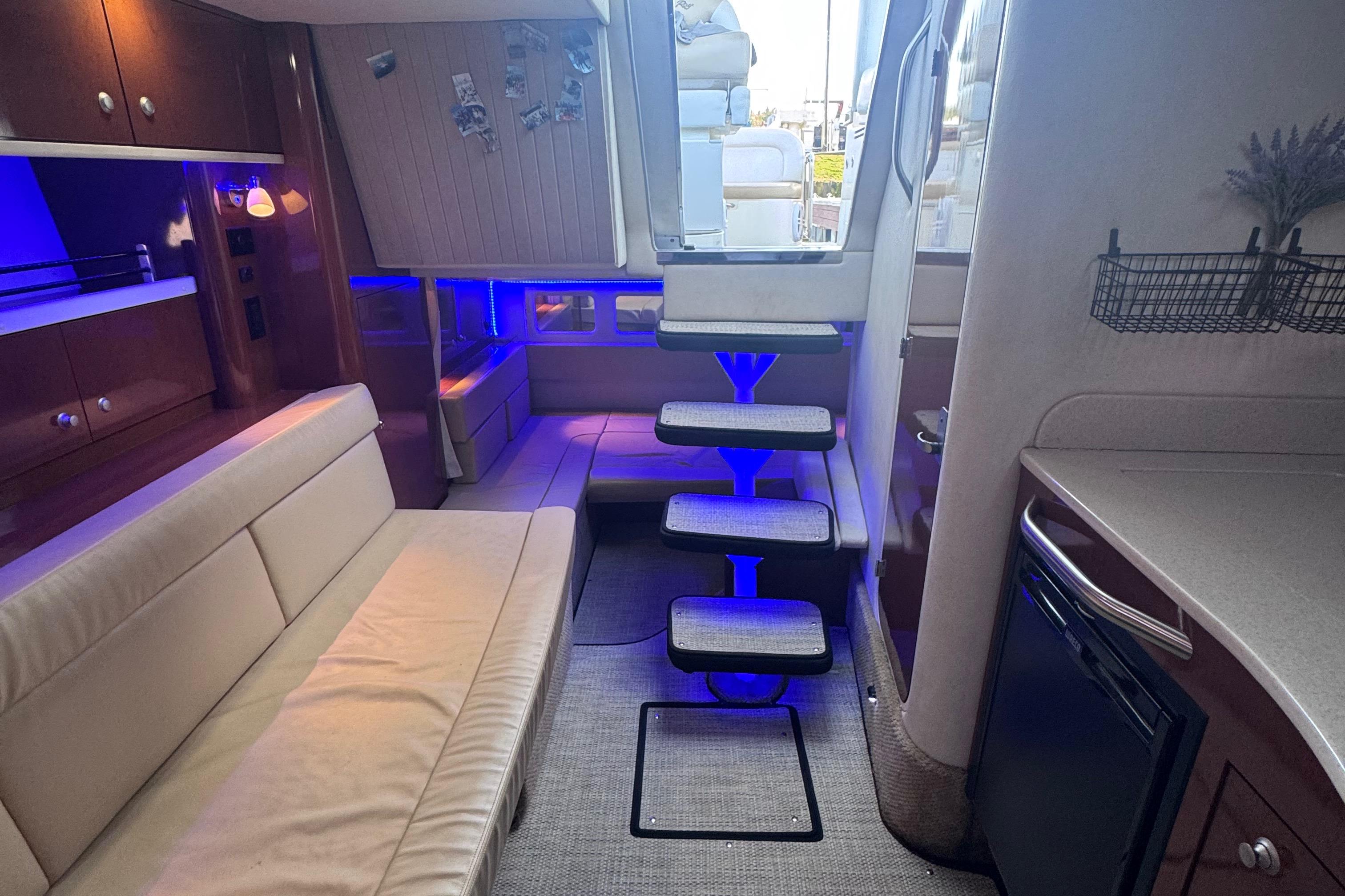 Interior of 2008 Sea Ray 350 Sundancer yacht with modern seating and ambient lighting.