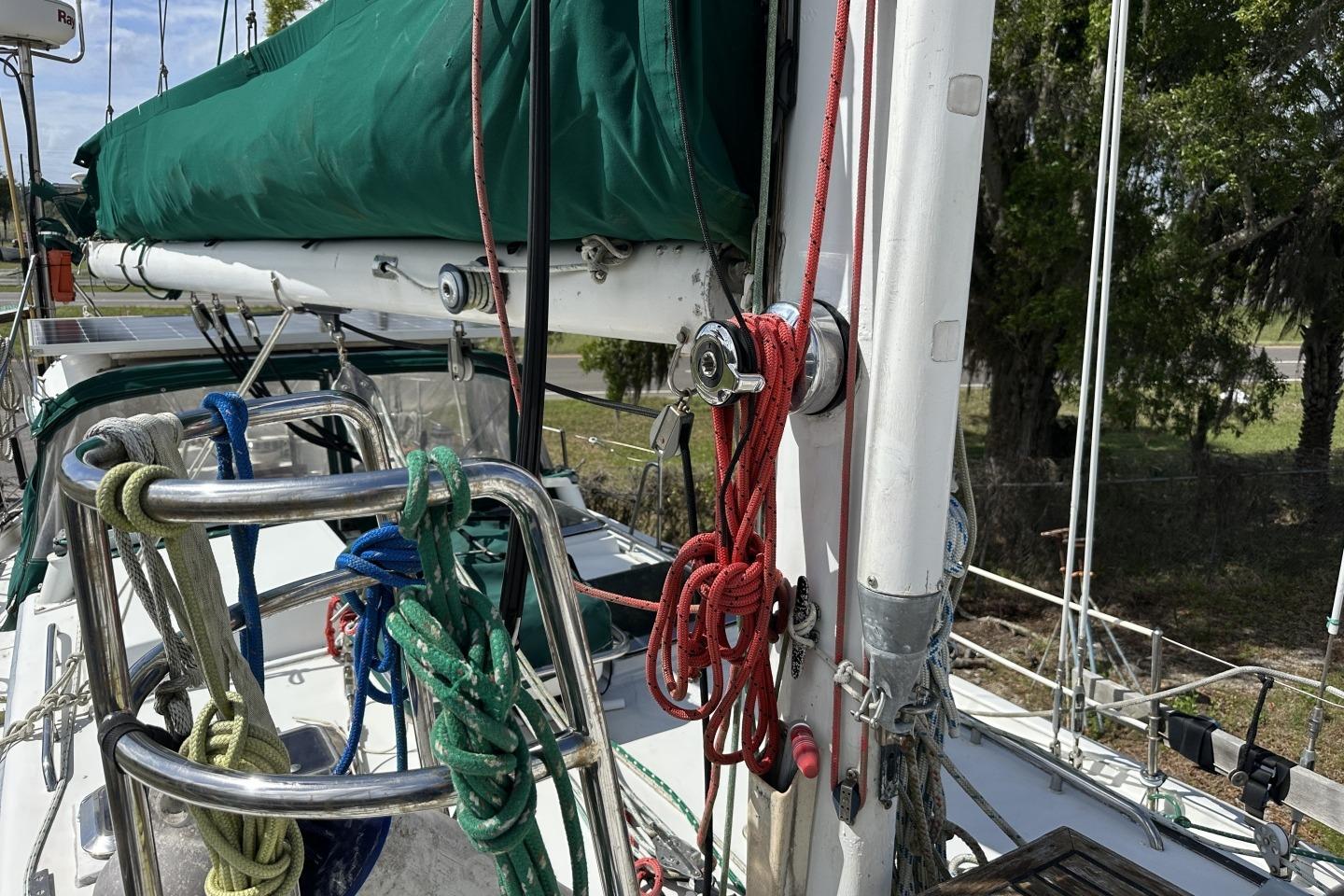 1976 Valiant 40 sailboat deck with ropes and green sail cover.