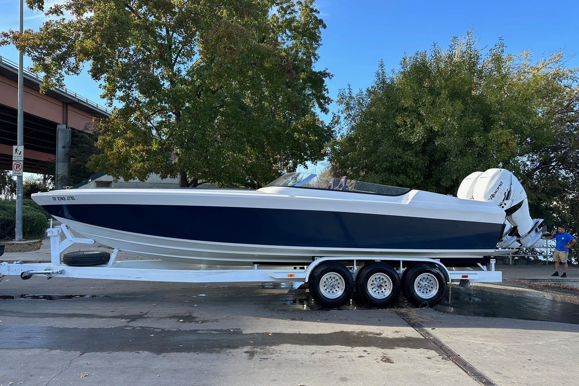 2017 Formula 292 SR-1 boat on trailer, parked outdoors near trees.