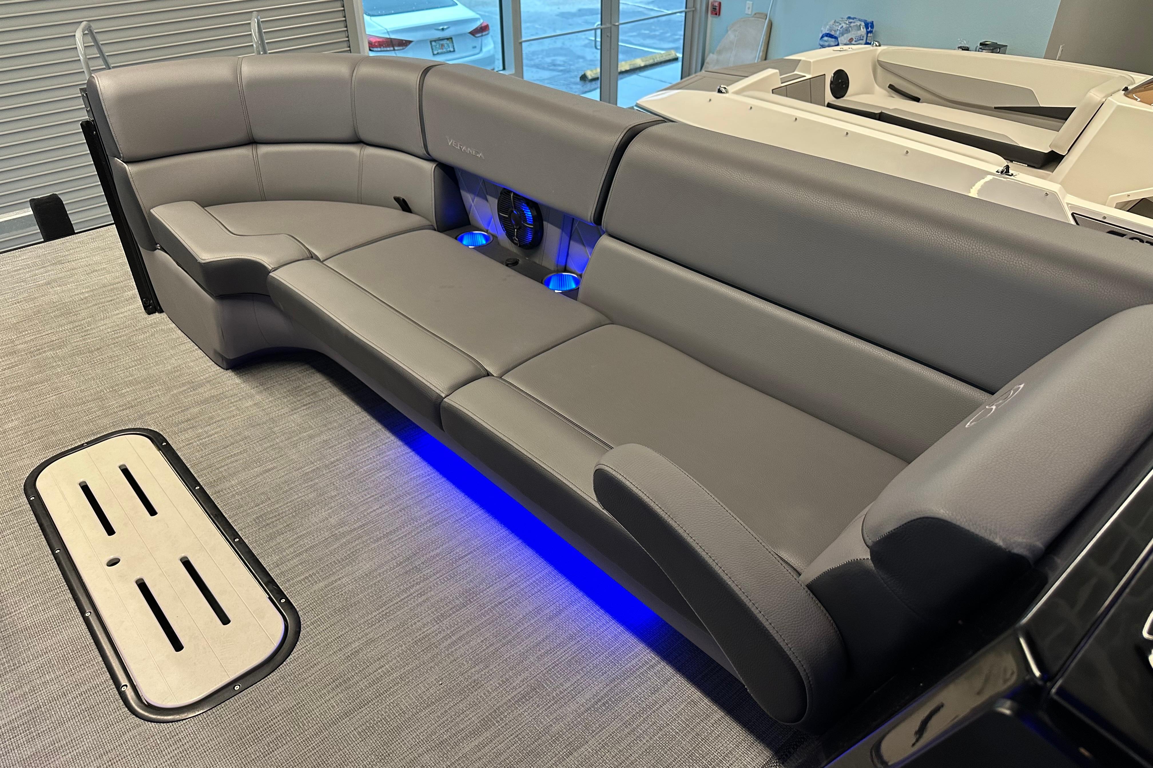 Luxurious seating in 2025 Veranda VX 27 DCRC boat with blue LED lighting.