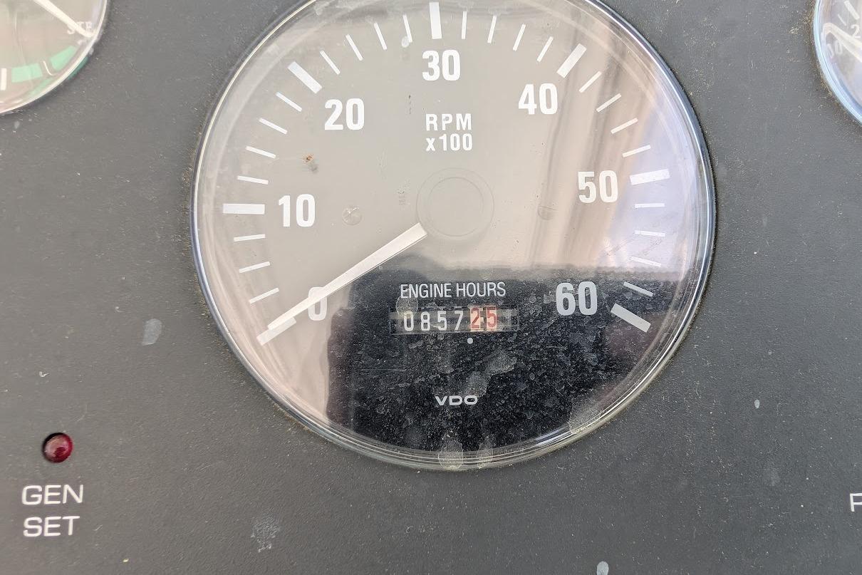 Tachometer showing 857.25 engine hours on a 2000 Pursuit 3400 Express boat.