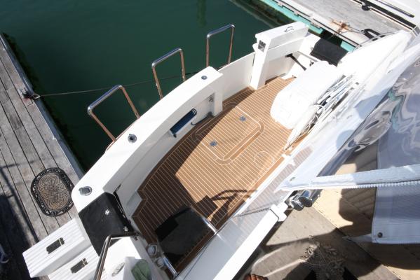 The cockpit of a Hatteras 52 yacht sits calmly at the dock.