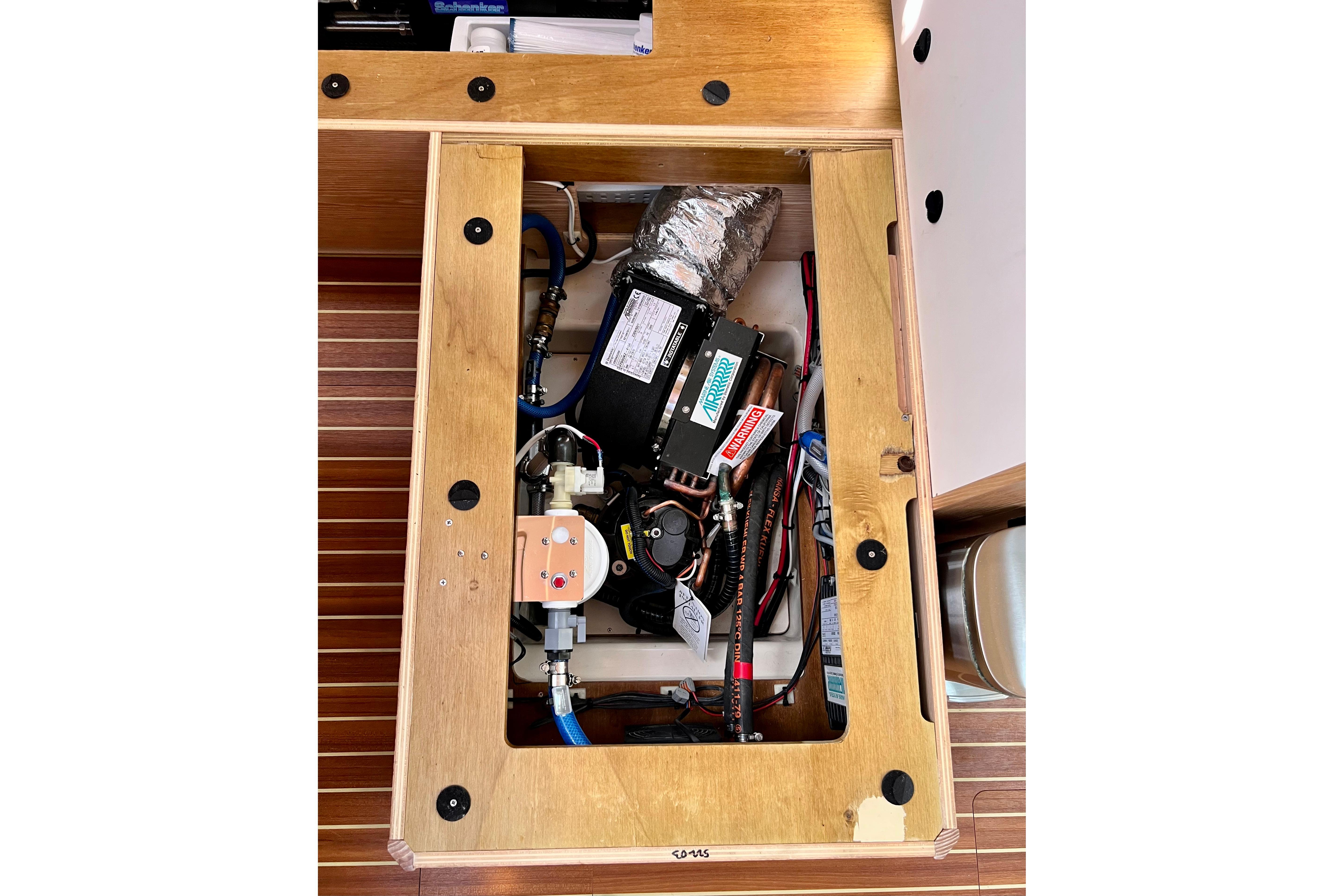 Engine compartment of a 2016 Hanse 455 yacht, showcasing mechanical components.