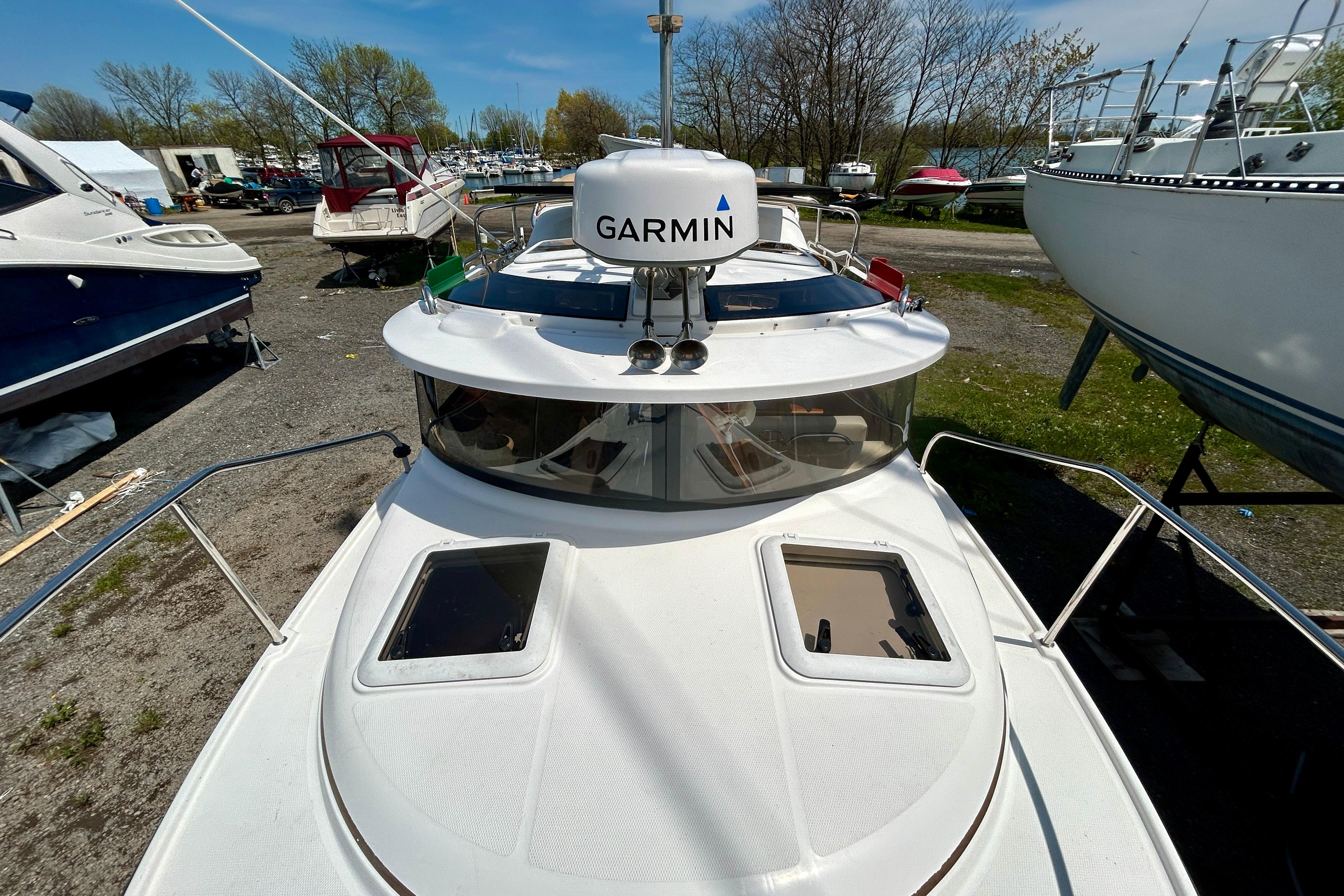 2018 Ranger Tugs R-23 boat with Garmin radar, docked outdoors.