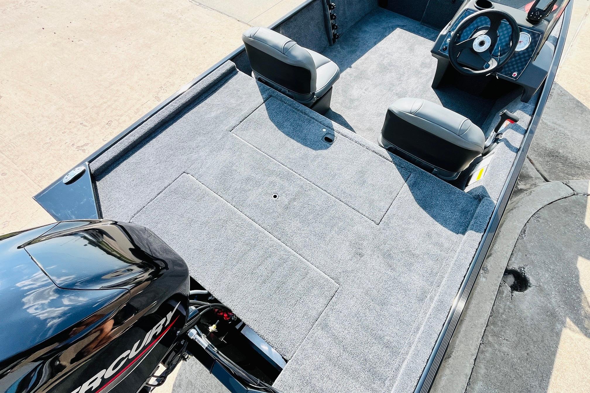 2026 Tracker Bass Tracker Classic XL boat interior with carpeted deck and dual seats.