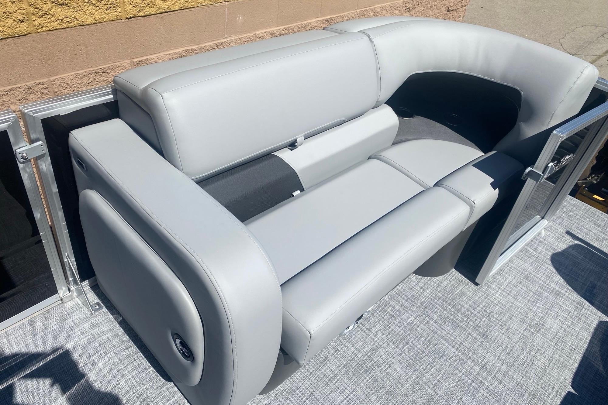 2026 Sun Tracker Party Barge 22 RF DLX with sleek gray seating.