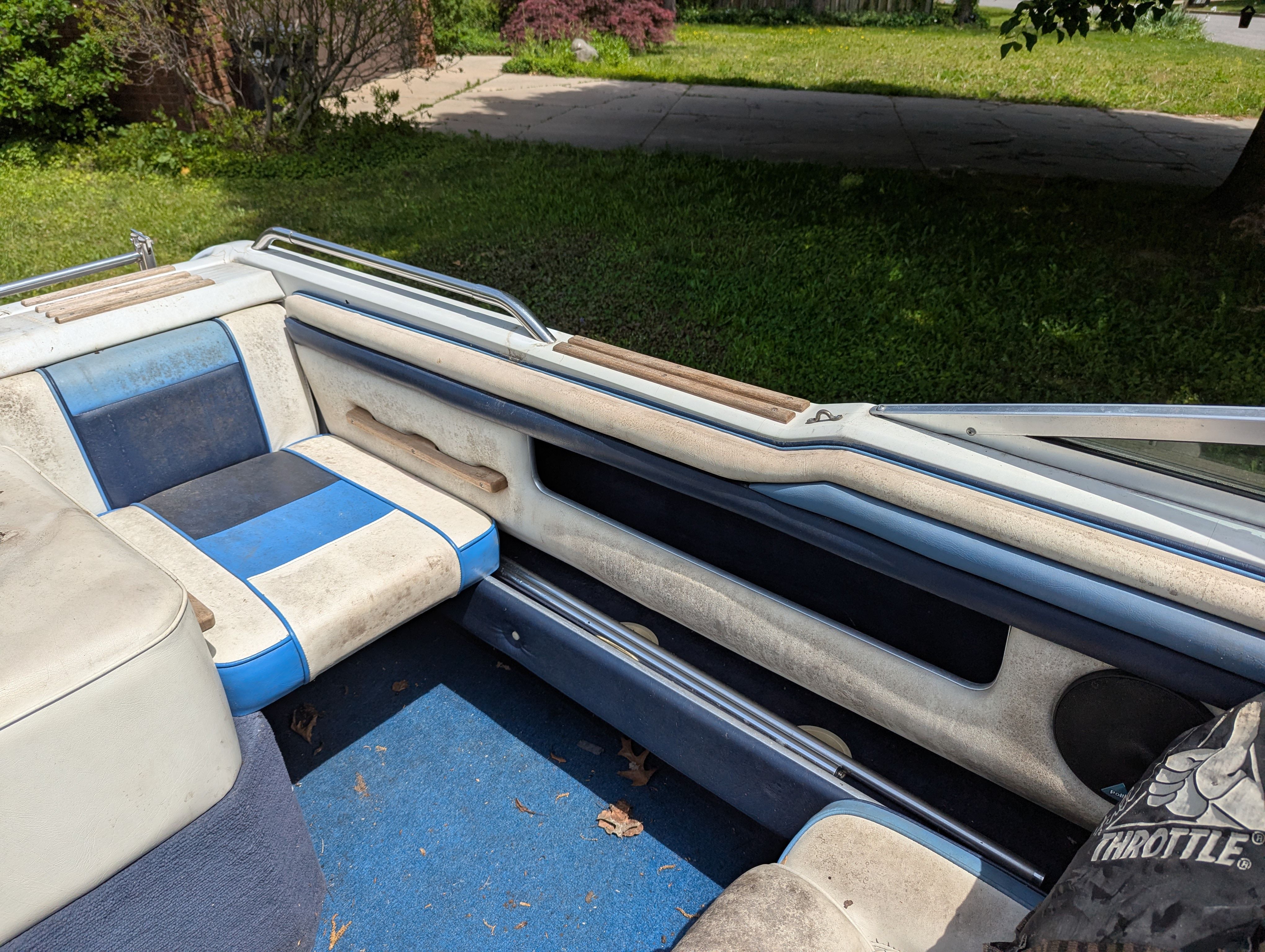 Interior of a 1988 Four Winns 200 Horizon boat with blue seating.