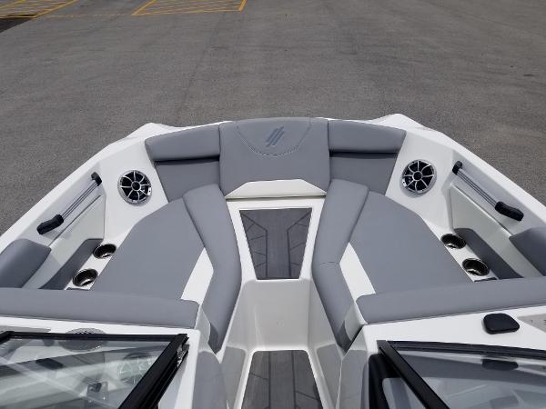 2023 ATX Surf Boats 20 Type-S bow seating area with gray upholstery and built-in speakers.