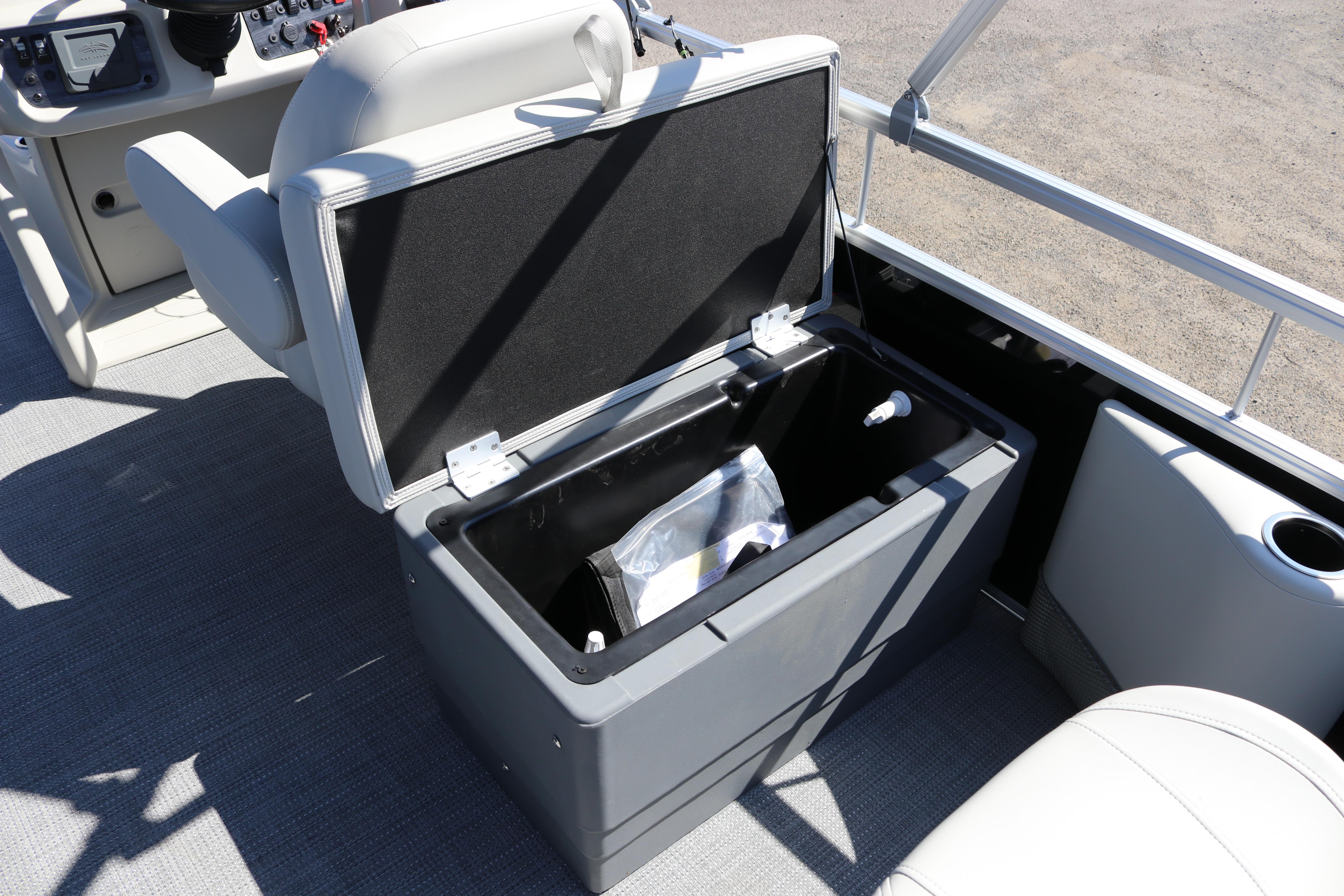 Open storage compartment on 2025 SunChaser Vista 20 Fish boat interior.