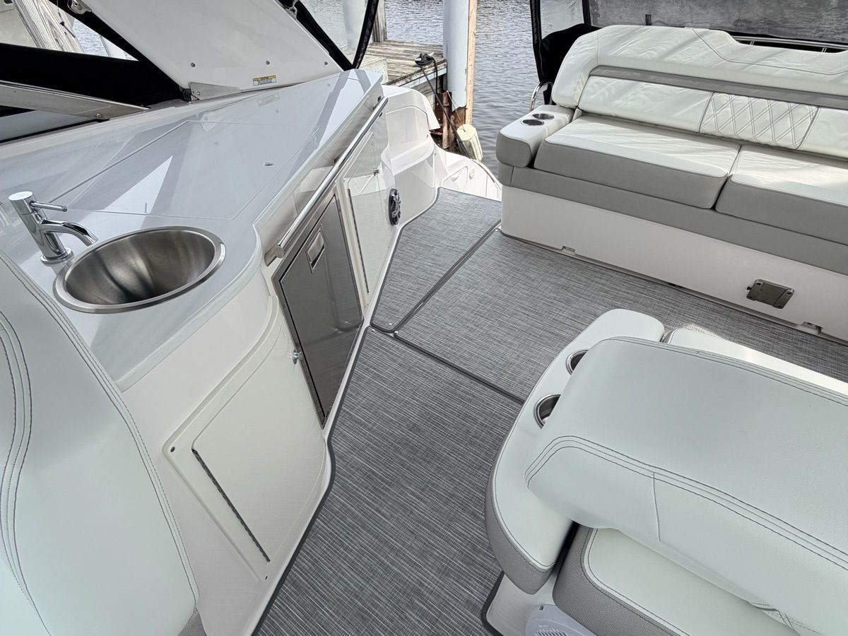 Interior of a 2021 Regal 33 Express with seating area and sink.