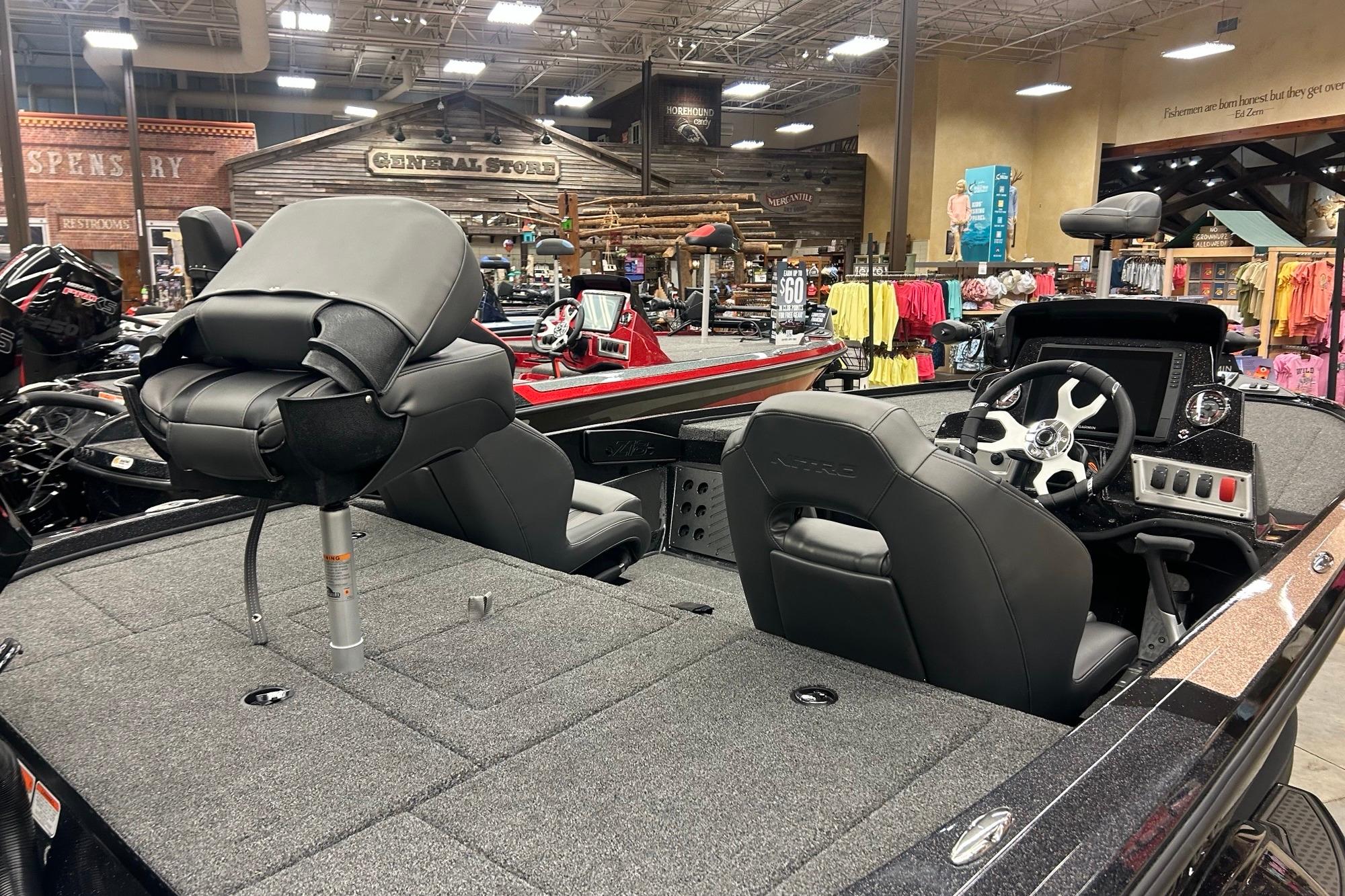 Nitro Z18 Pro 2026 fishing boat interior with seating and control panel in showroom.