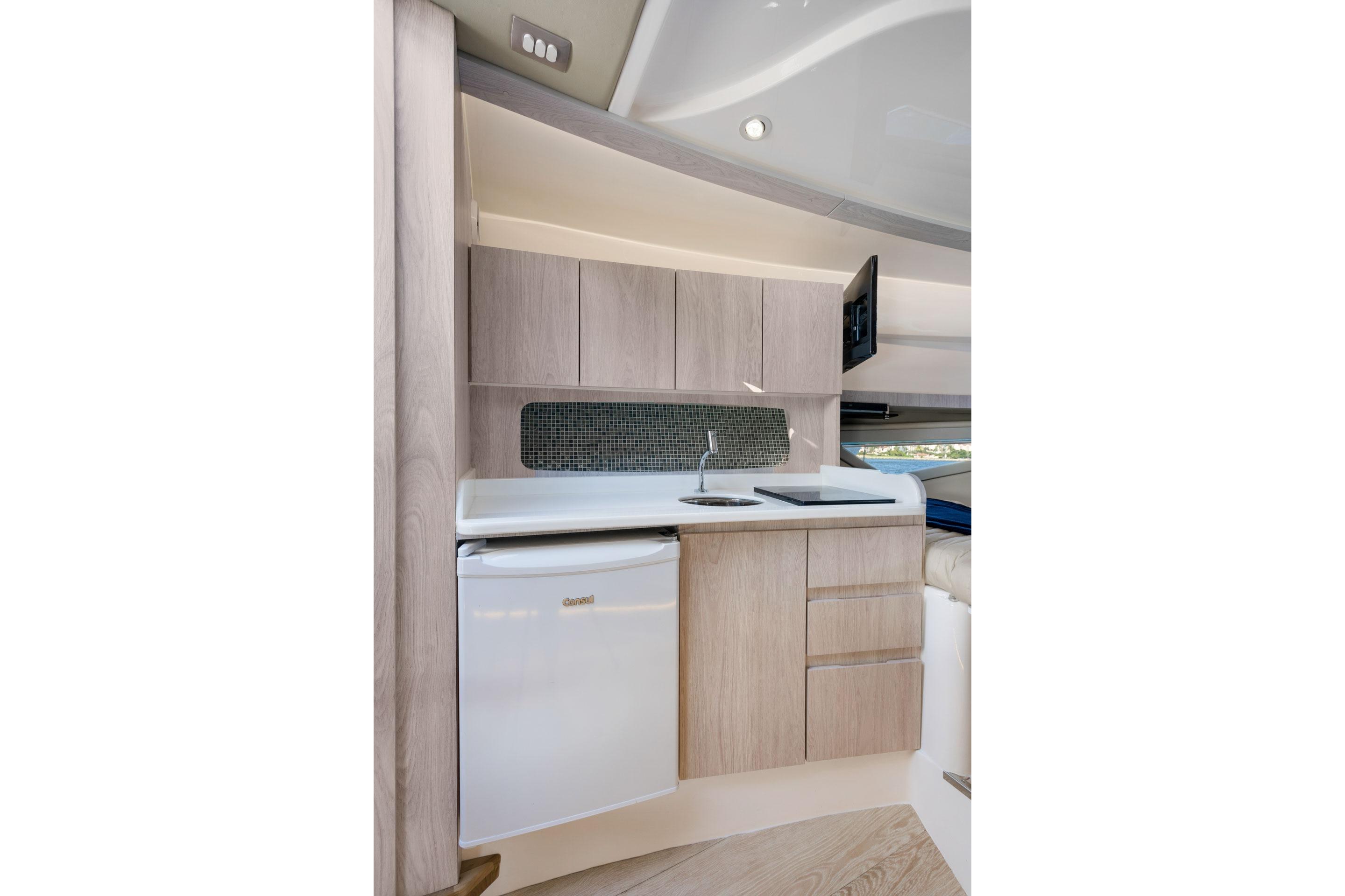 Modern kitchen in 2026 Hanover 375 yacht with sleek cabinetry and compact appliances.