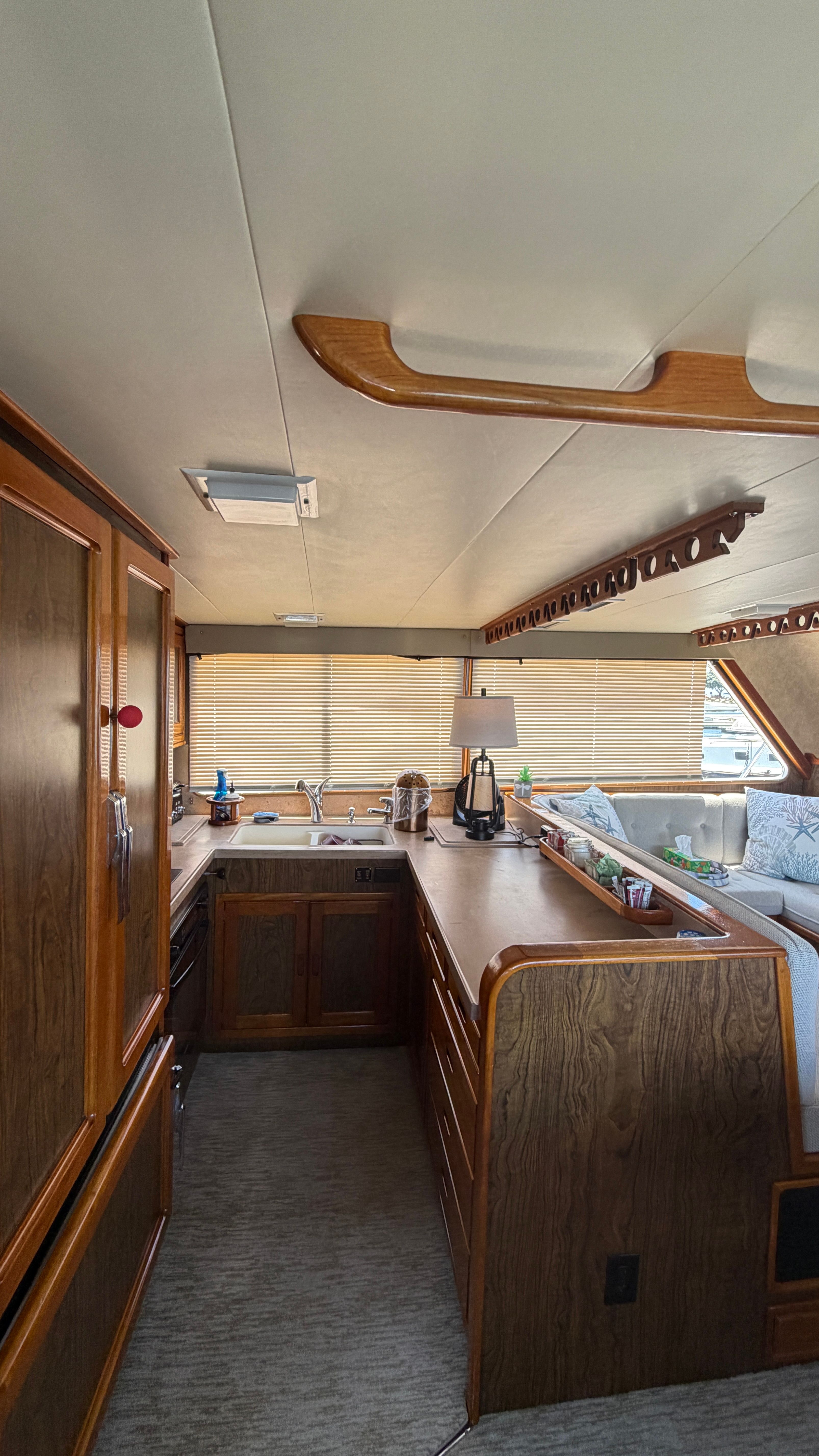 Interior of a 1966 Drake Yachtfisher with wooden furnishings.
