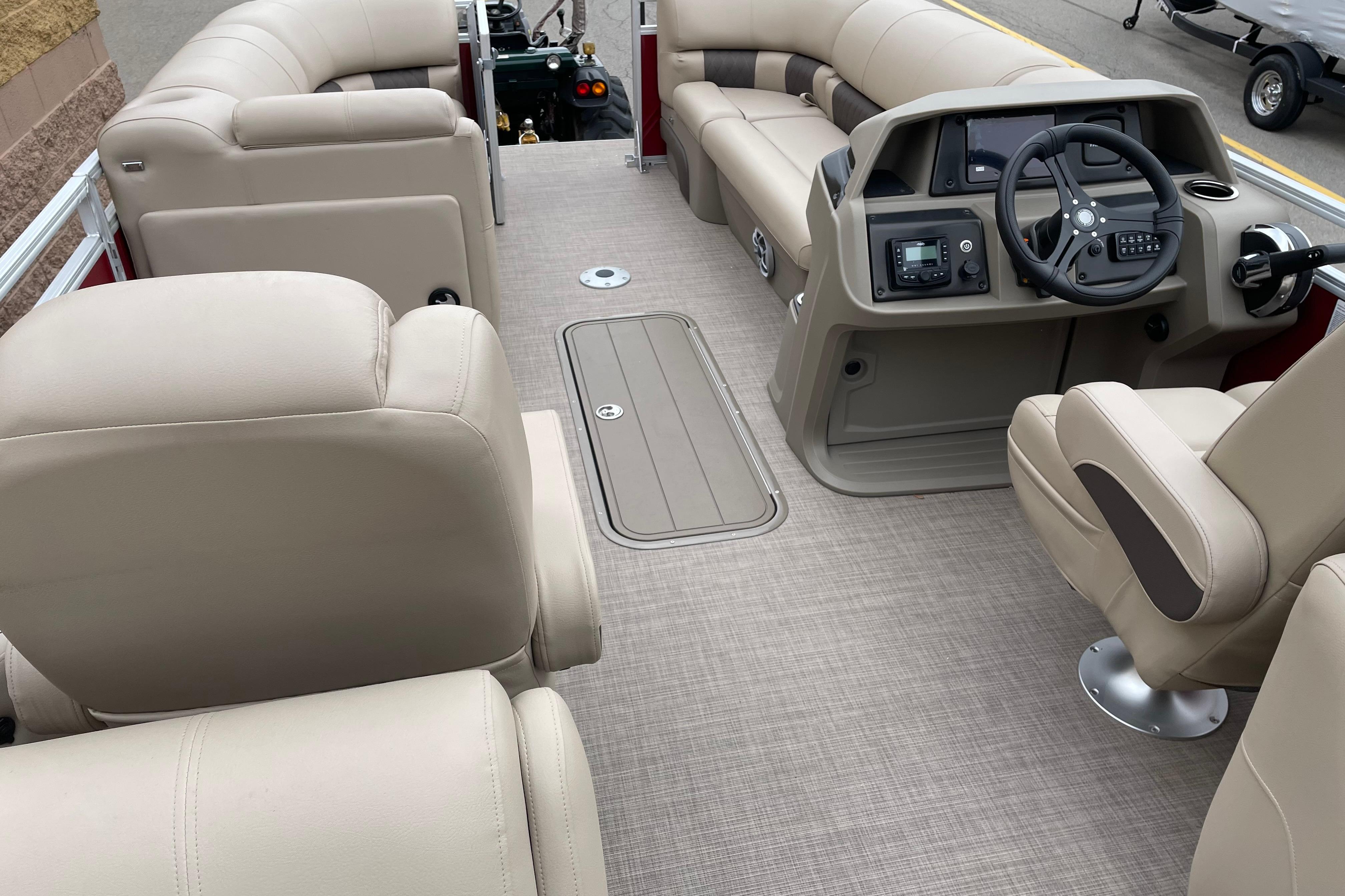 Luxurious interior of 2025 Sun Tracker Party Barge 22 XP3 pontoon boat with plush seating.