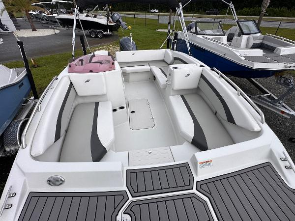 2024 Starcraft 171 SVX boat with spacious seating and modern design, displayed outdoors.