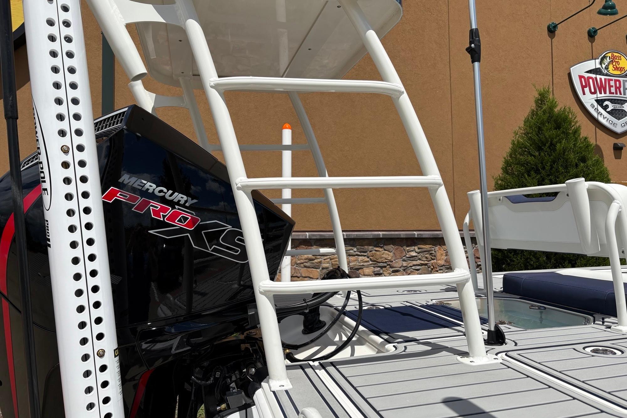 2026 Mako 18 Pro Skiff Patriot Edition with Mercury Pro XS engine, docked outdoors.