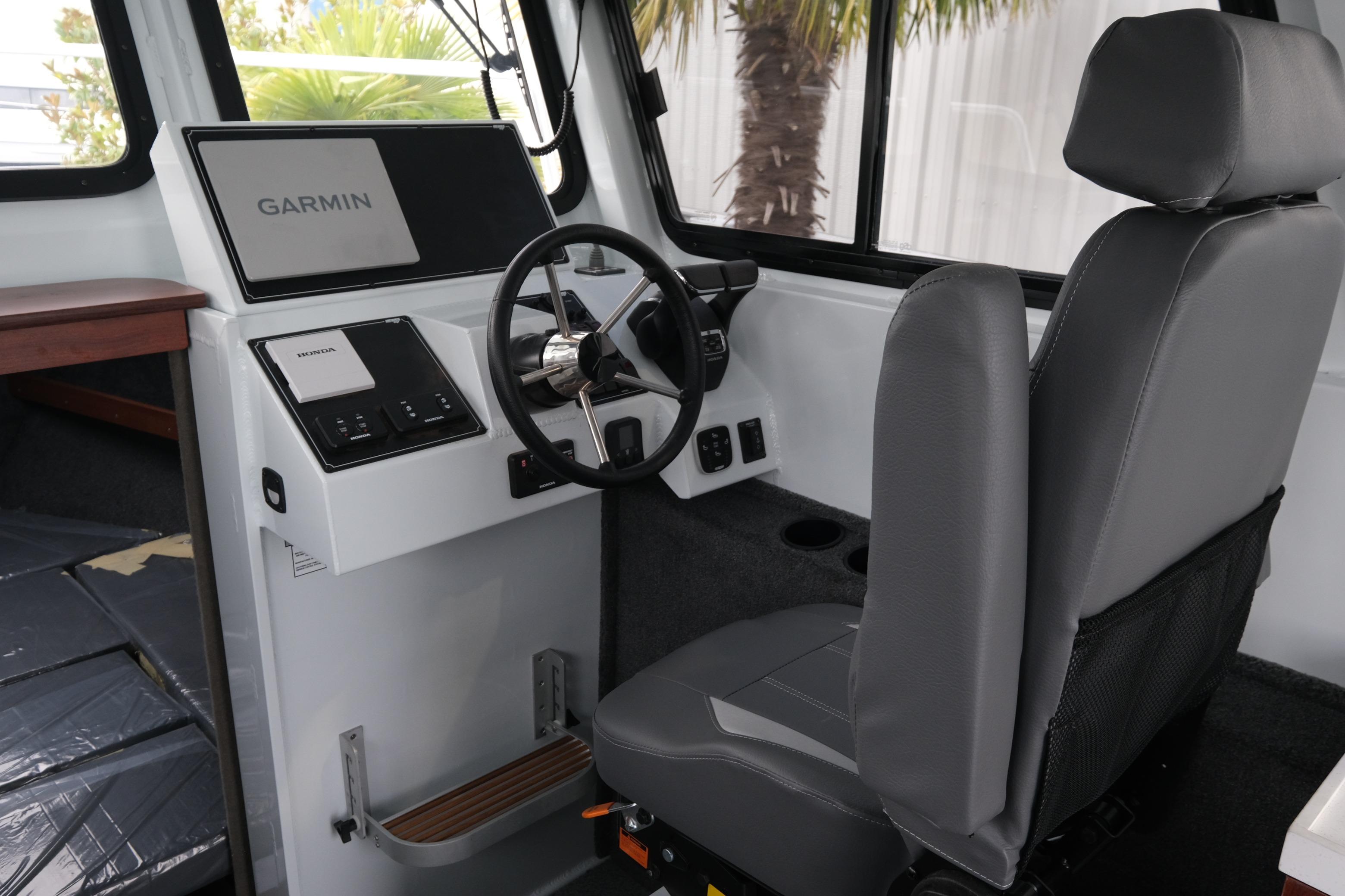 Interior of 2026 Hewescraft 270 Pacific Explorer with Garmin navigation system.