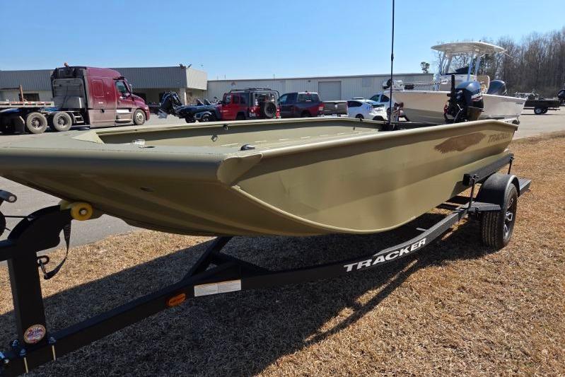 2026 Tracker Grizzly 1650 T Prairie Wings Edition boat on trailer, outdoor setting.