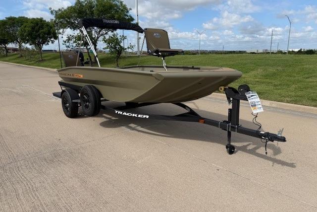 2026 Tracker Grizzly 1756 T Marsh boat on trailer, parked on a sunny road.