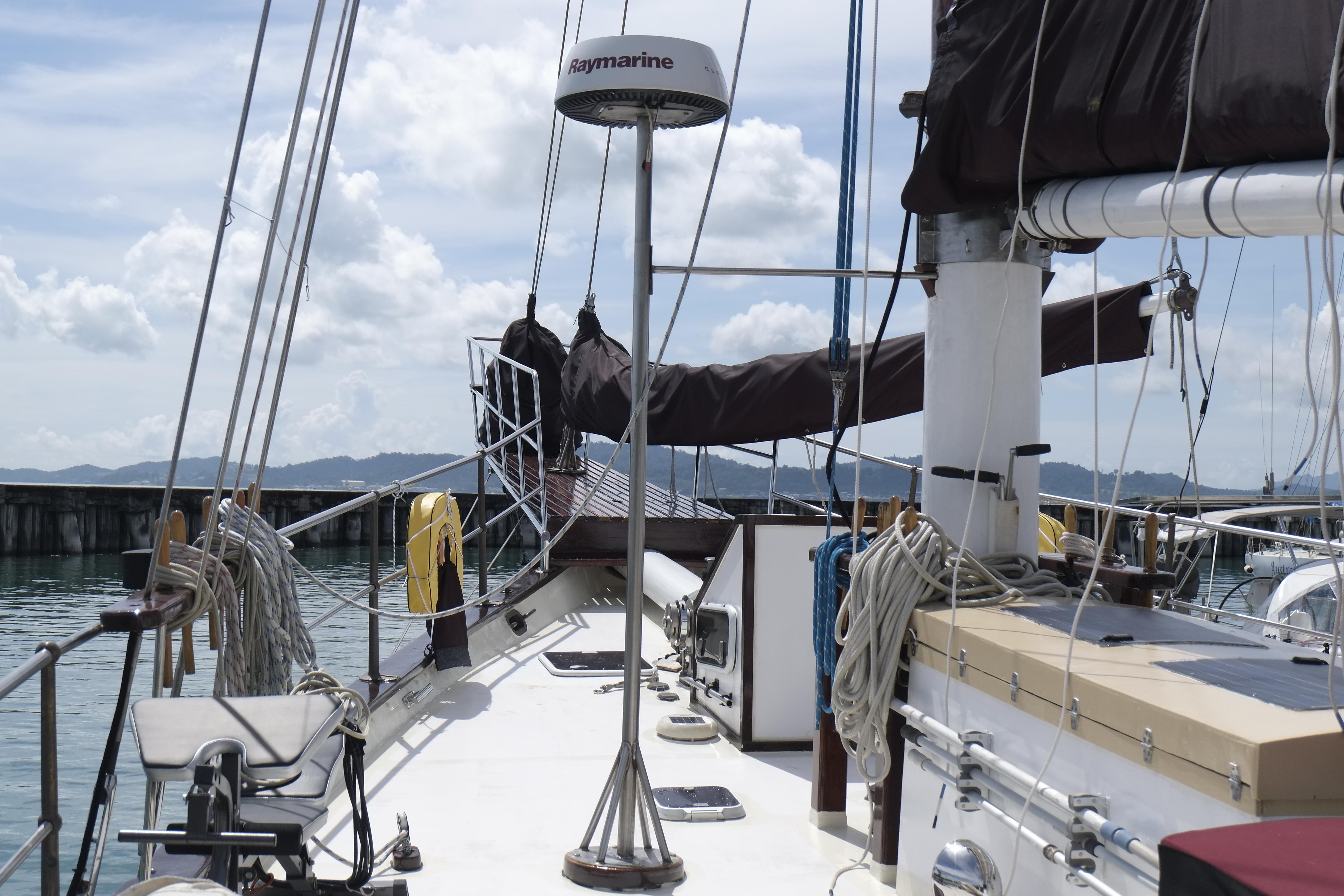Custom Bud Macintosh schooner, 2006, docked with sails down, featuring nautical equipment and clear skies.