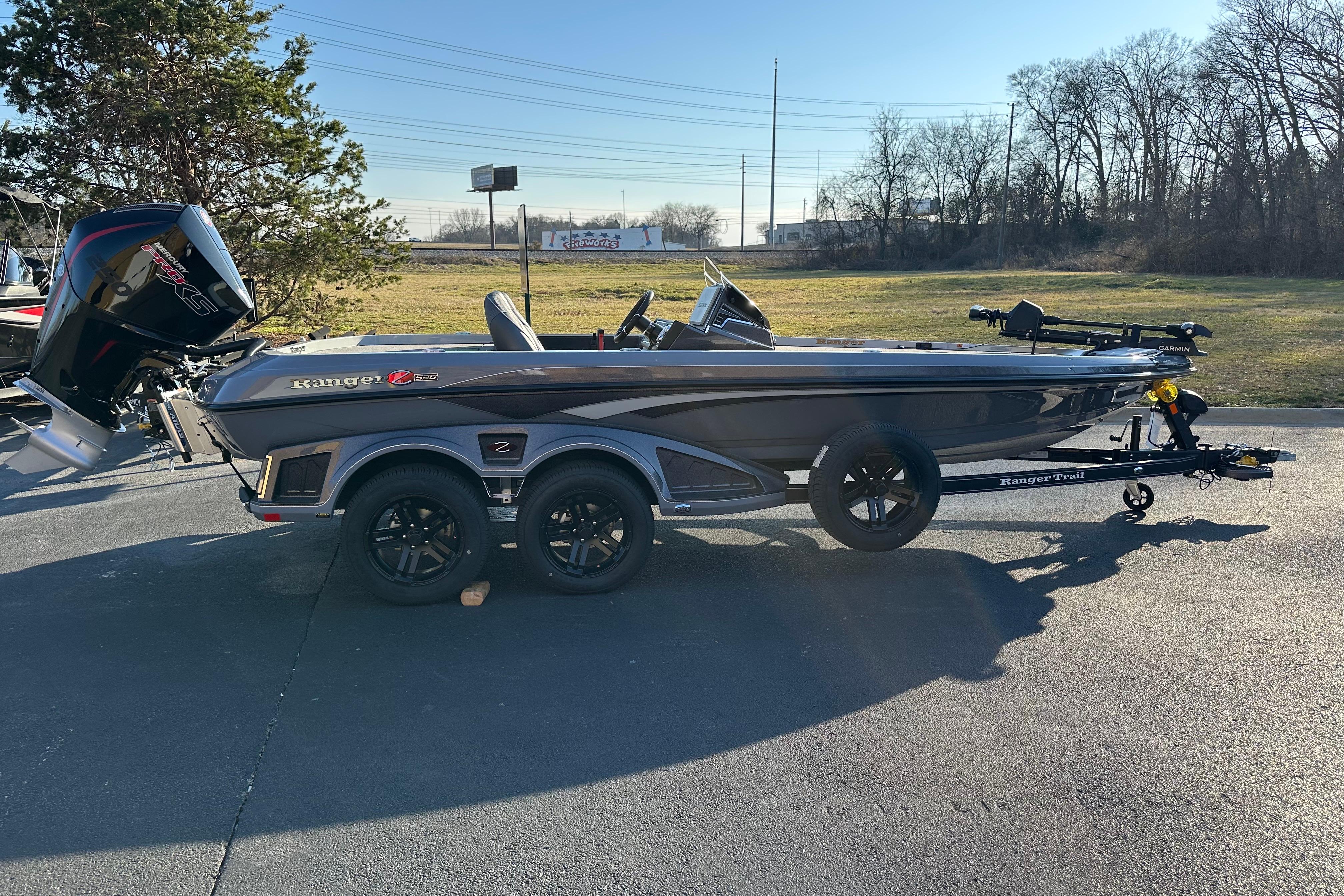 2026 Ranger Z520 boat on trailer, parked outdoors in sunny setting.