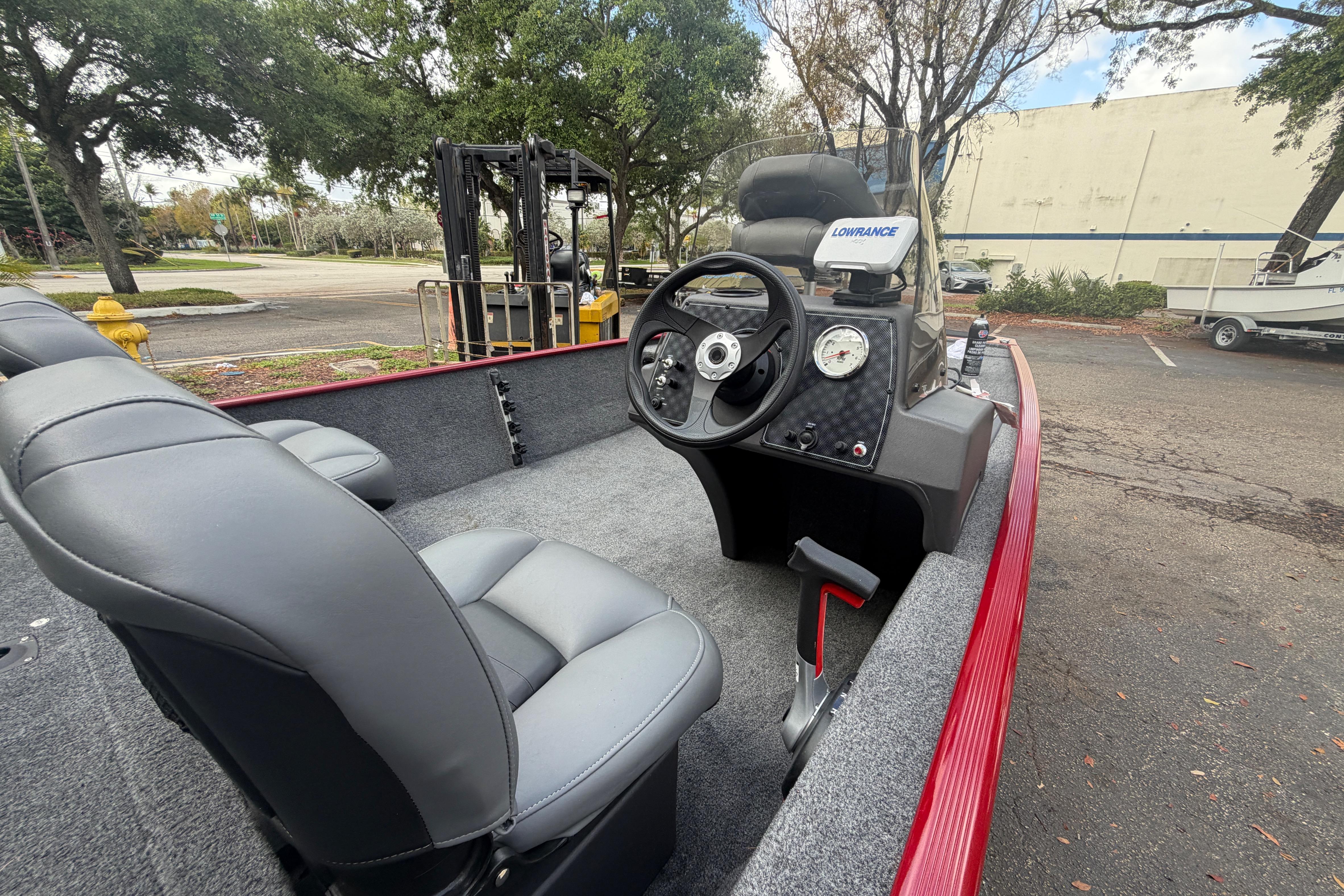 2023 Bass Tracker III Classic boat interior with steering wheel and seats.