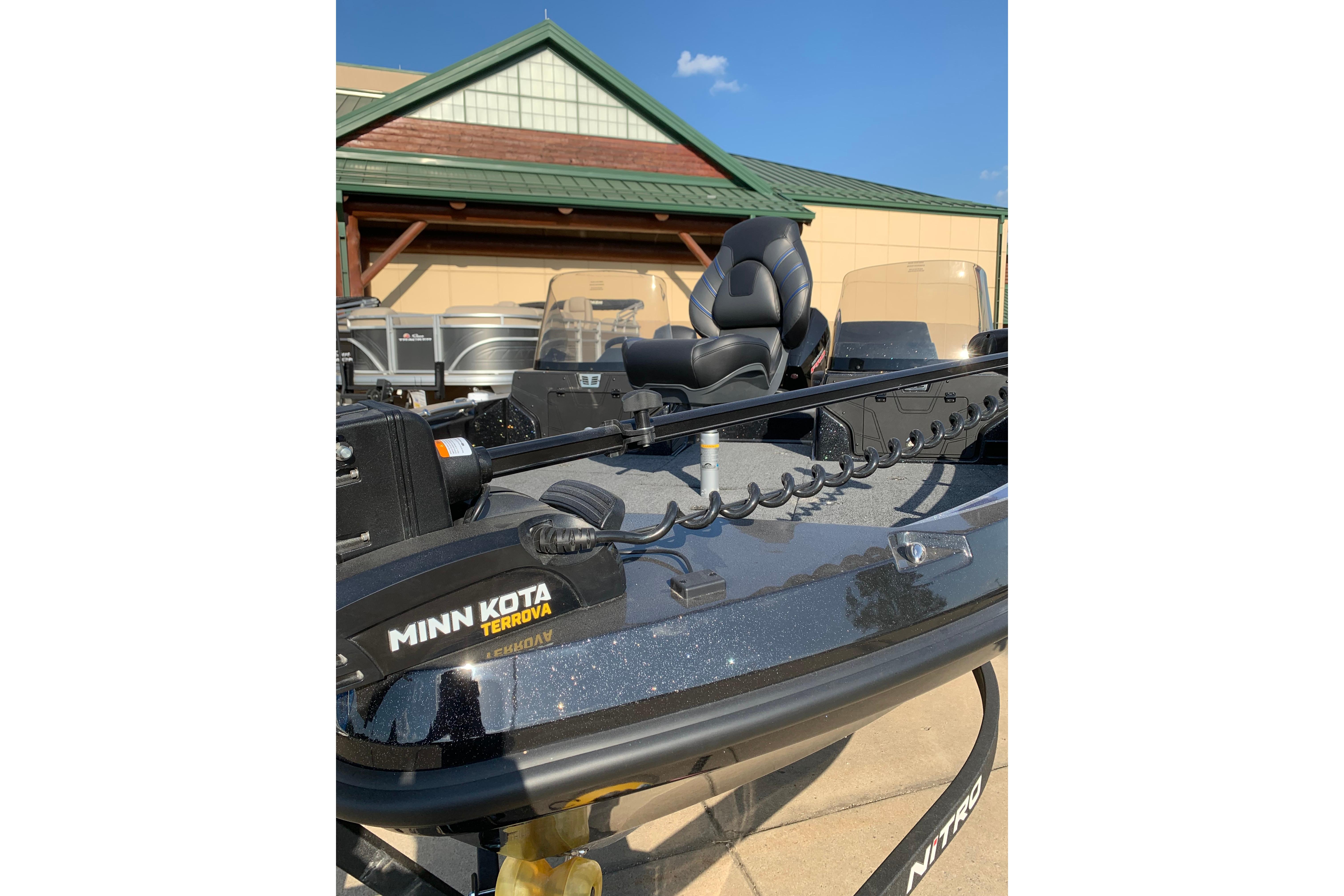 2025 Nitro ZV20 boat with Minn Kota Terrova motor, parked outdoors.