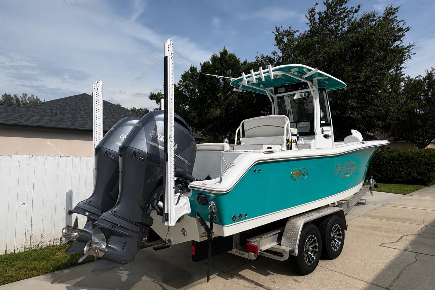 2021 Sea Hunt Ultra 265 SE boat on trailer, featuring dual Yamaha outboard engines.