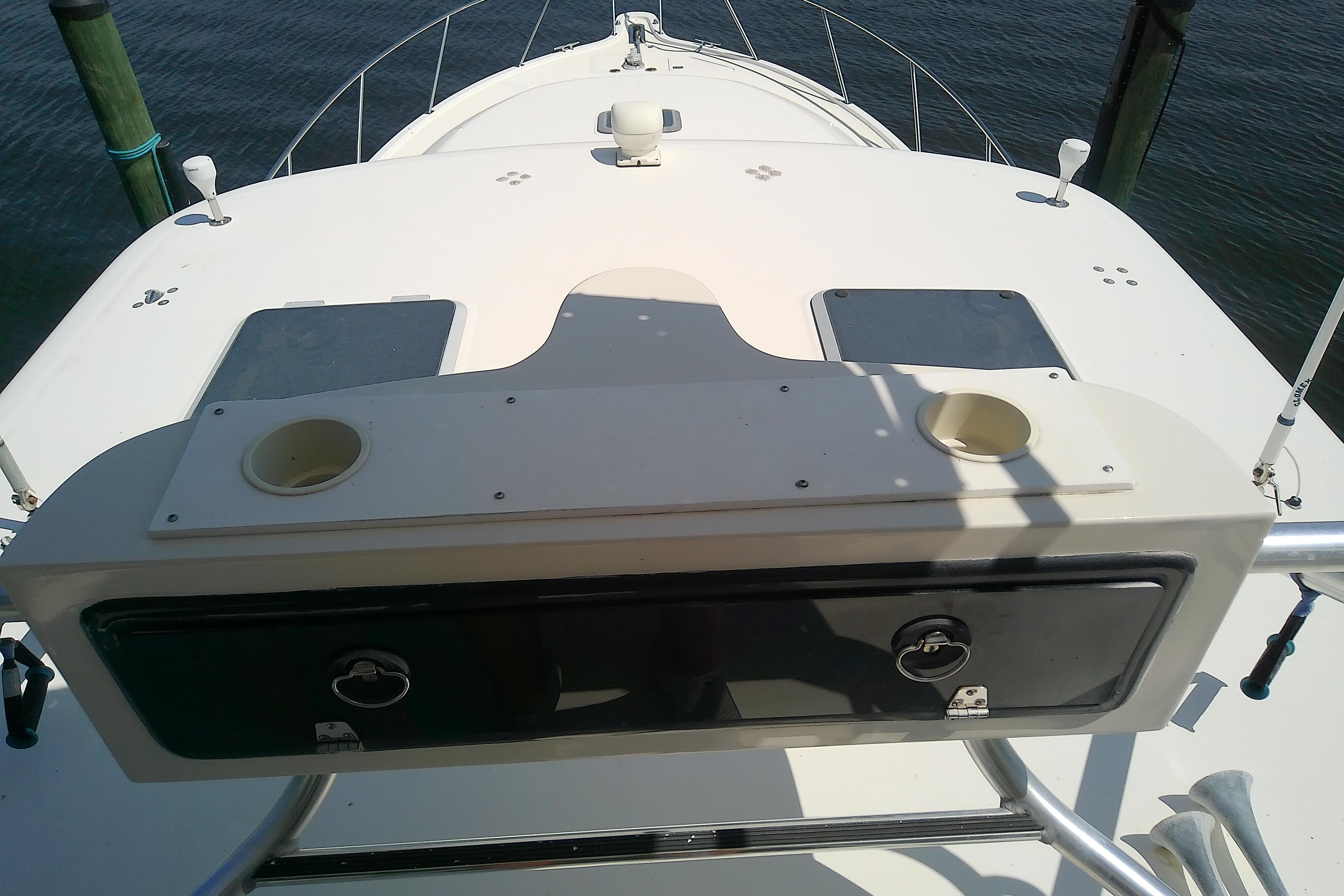 2000 Tiara Yachts 4100 Open deck with rod holders and storage compartments.
