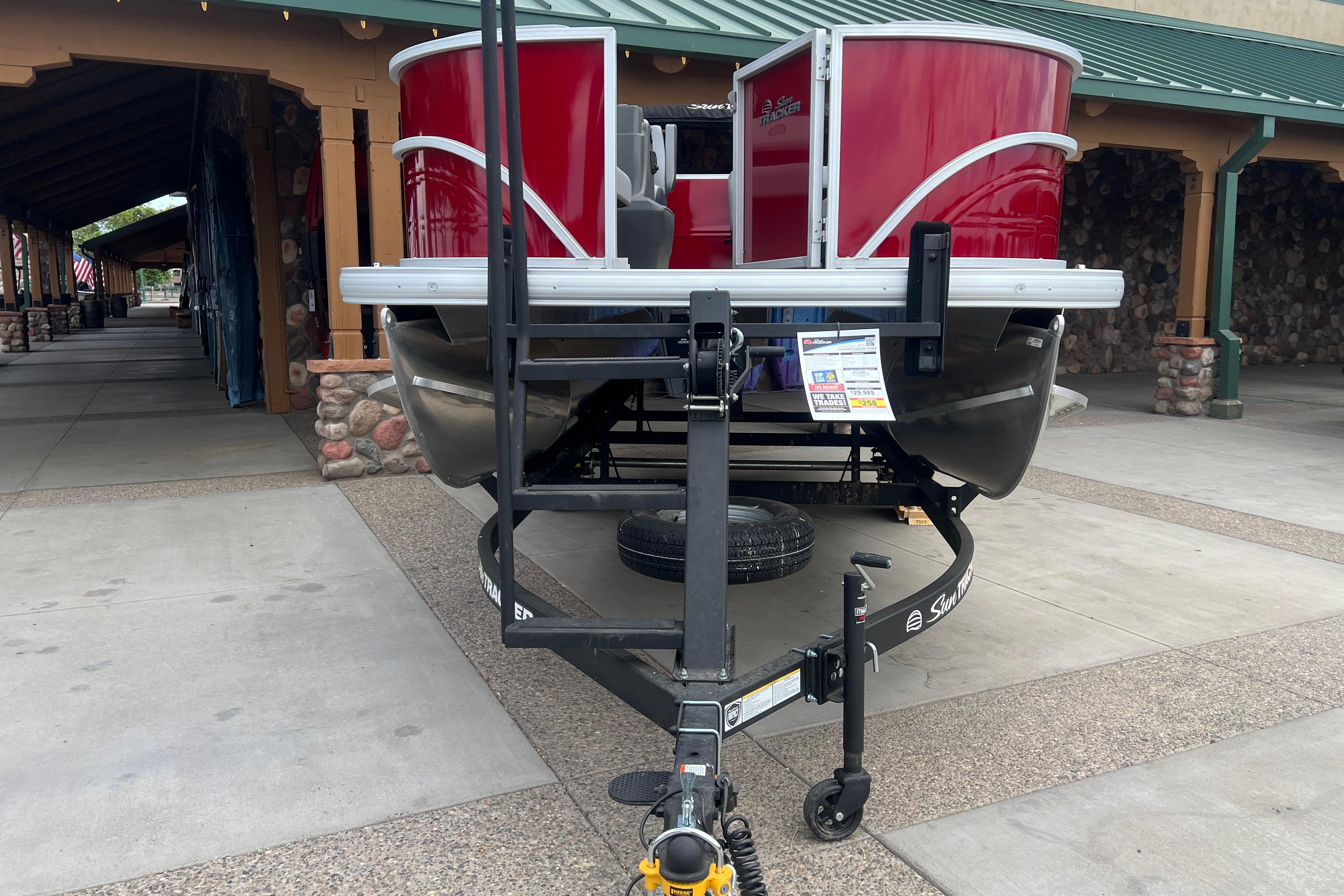 2026 Sun Tracker Party Barge 16 DLX pontoon boat displayed outdoors.