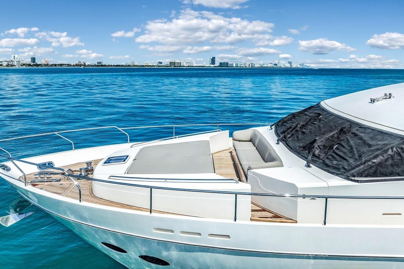 Luxurious 2012 Princess 85 yacht on serene blue waters with city skyline.