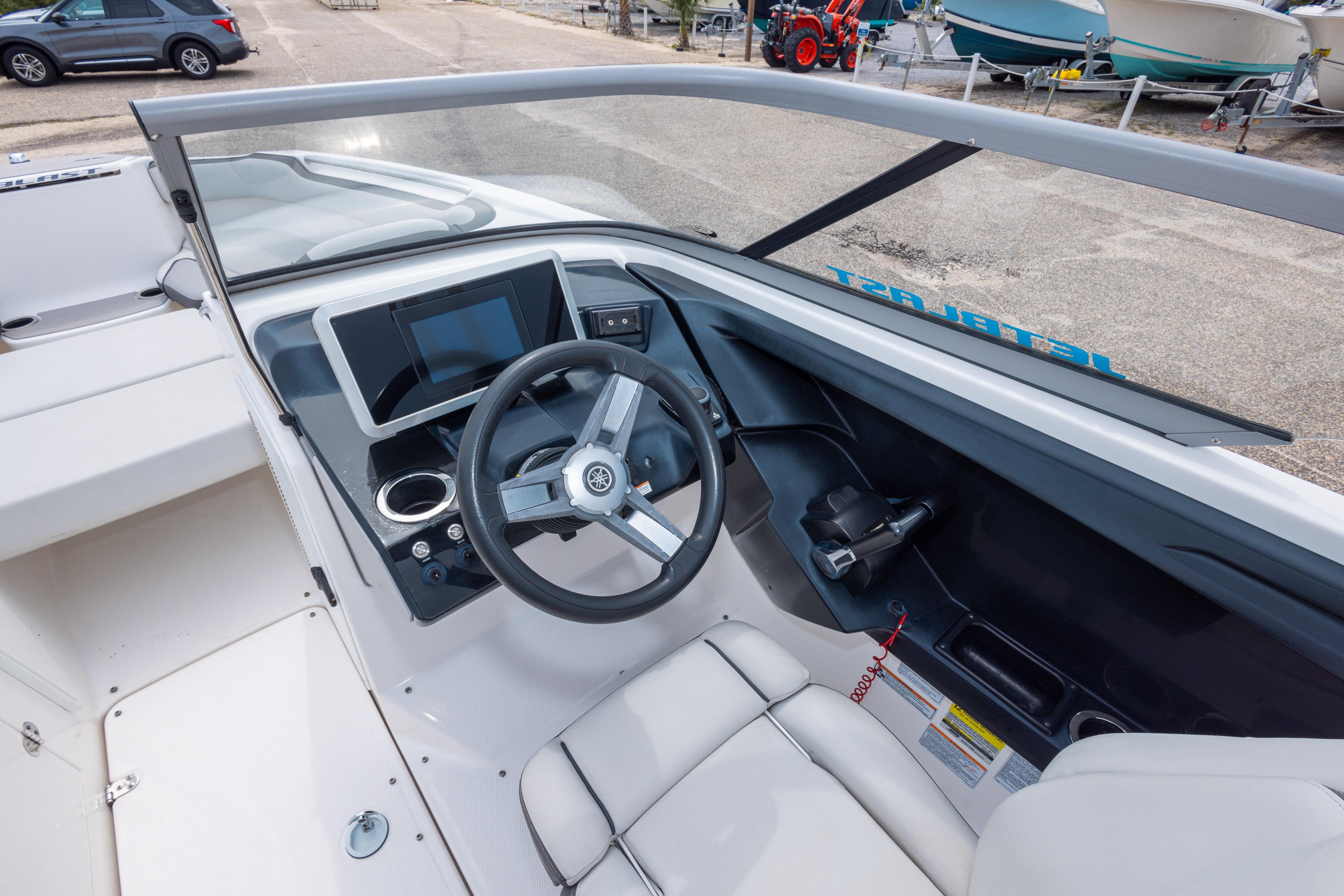 2021 Yamaha Boats AR250 cockpit with steering wheel, touchscreen, and controls.