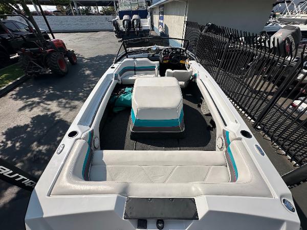 1992 Correct Craft Ski Nautique boat interior with white and teal seating.