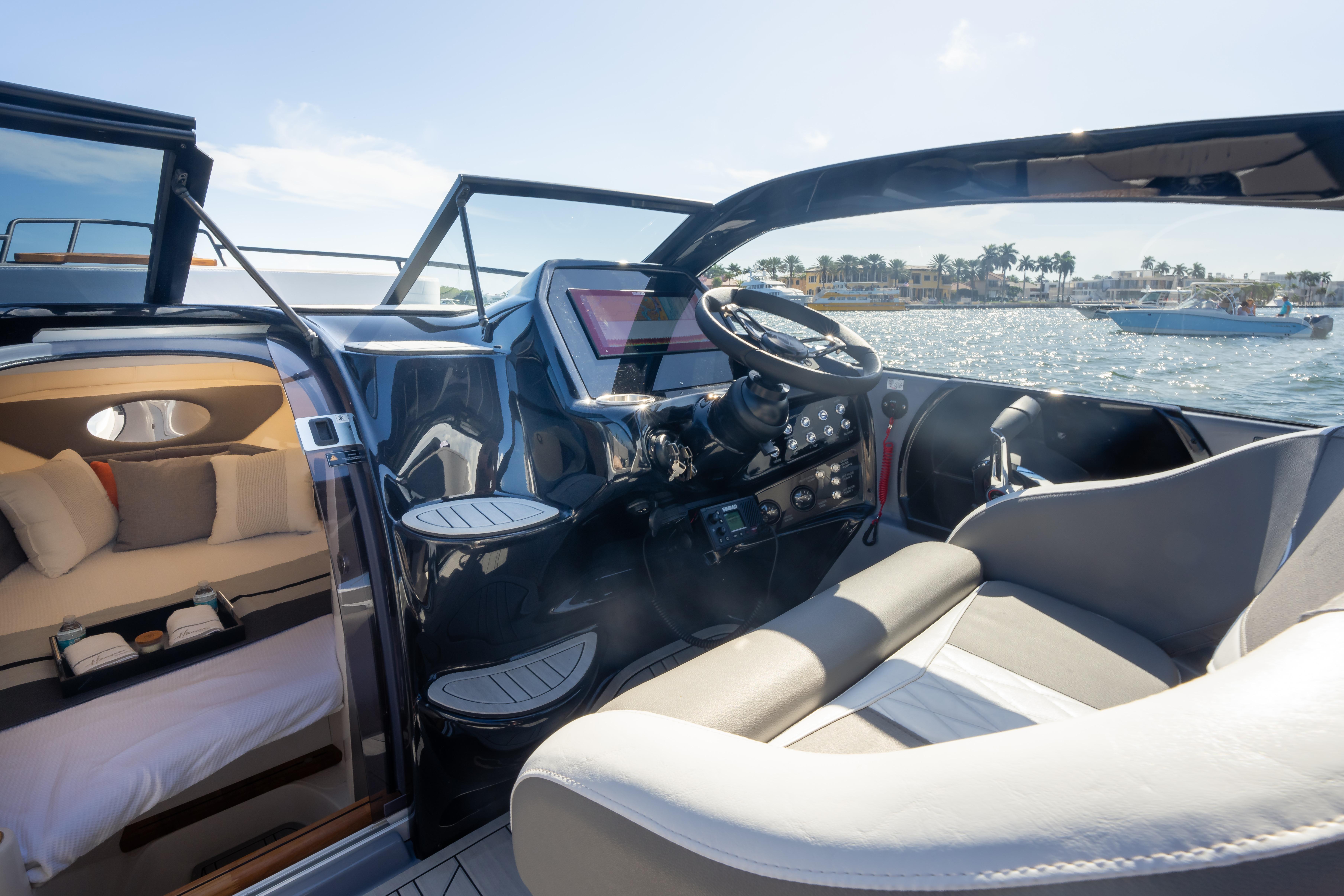 Luxurious Hanover 305 yacht interior, 2026 model, featuring modern cockpit and cozy cabin.