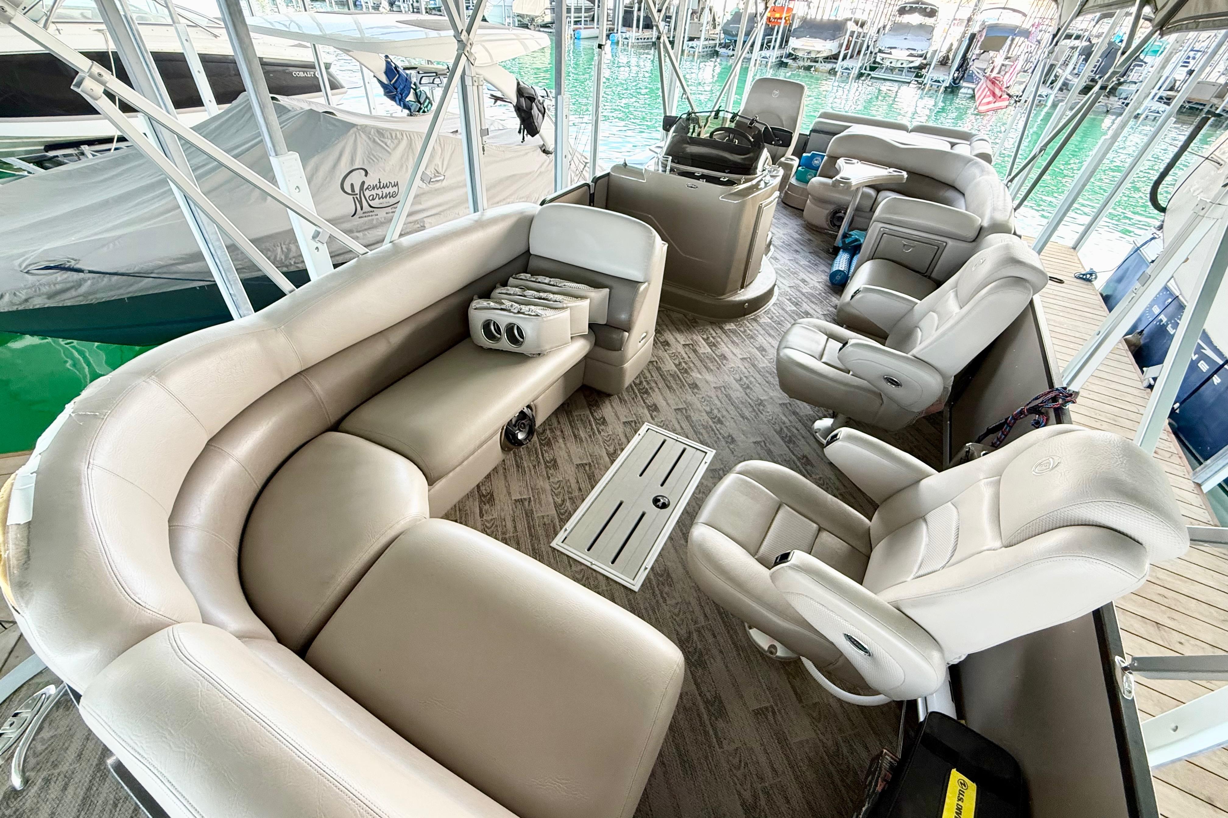 2011 Premier 275 Grand Majestic PTX pontoon boat interior with luxurious seating and helm.