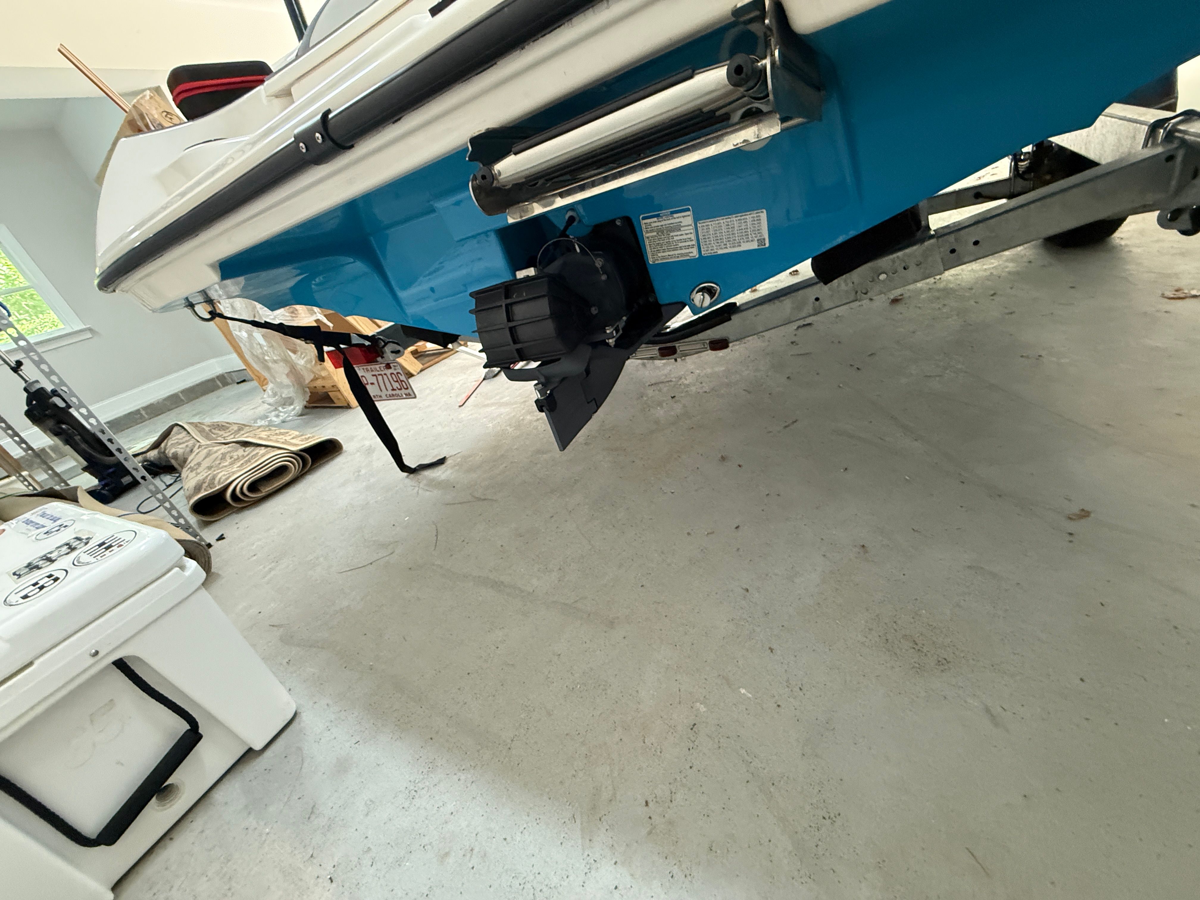 Yamaha SX190 boat 2023 on trailer in garage.