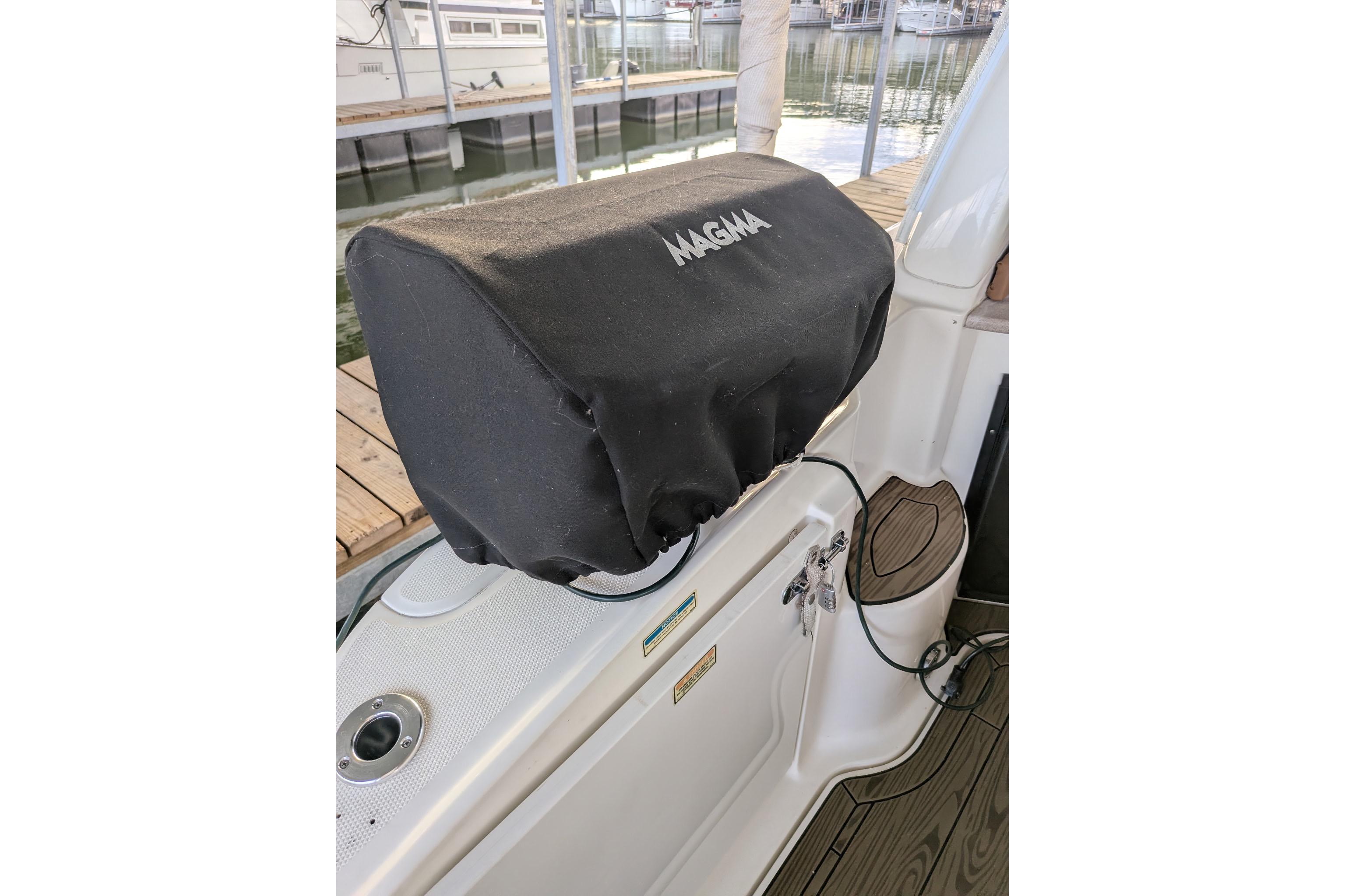 Covered grill on 2002 Sea Ray Sundancer 320 boat deck.